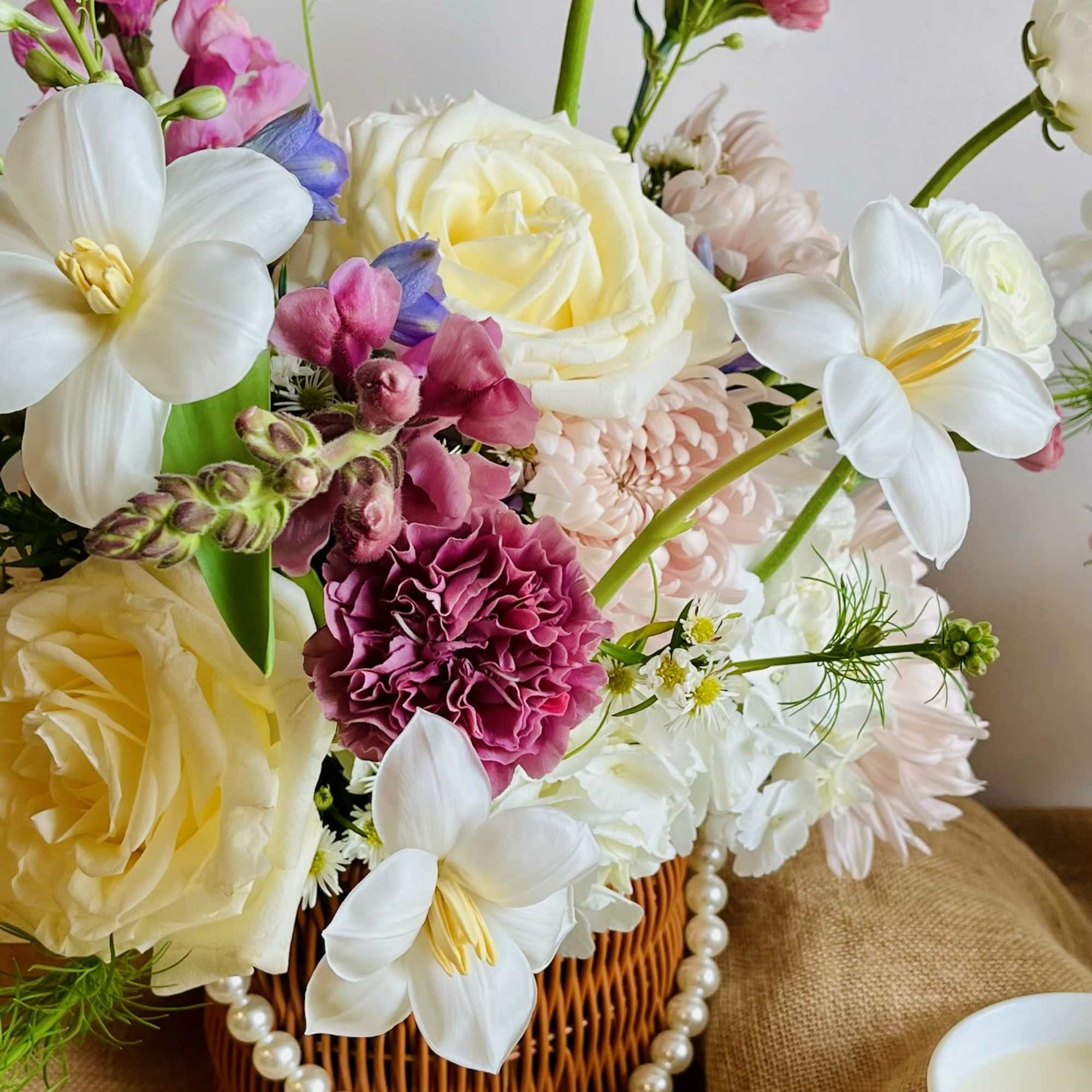 An upscale Mother&rsquo;s Day flower basket filled with locally grown blooms in