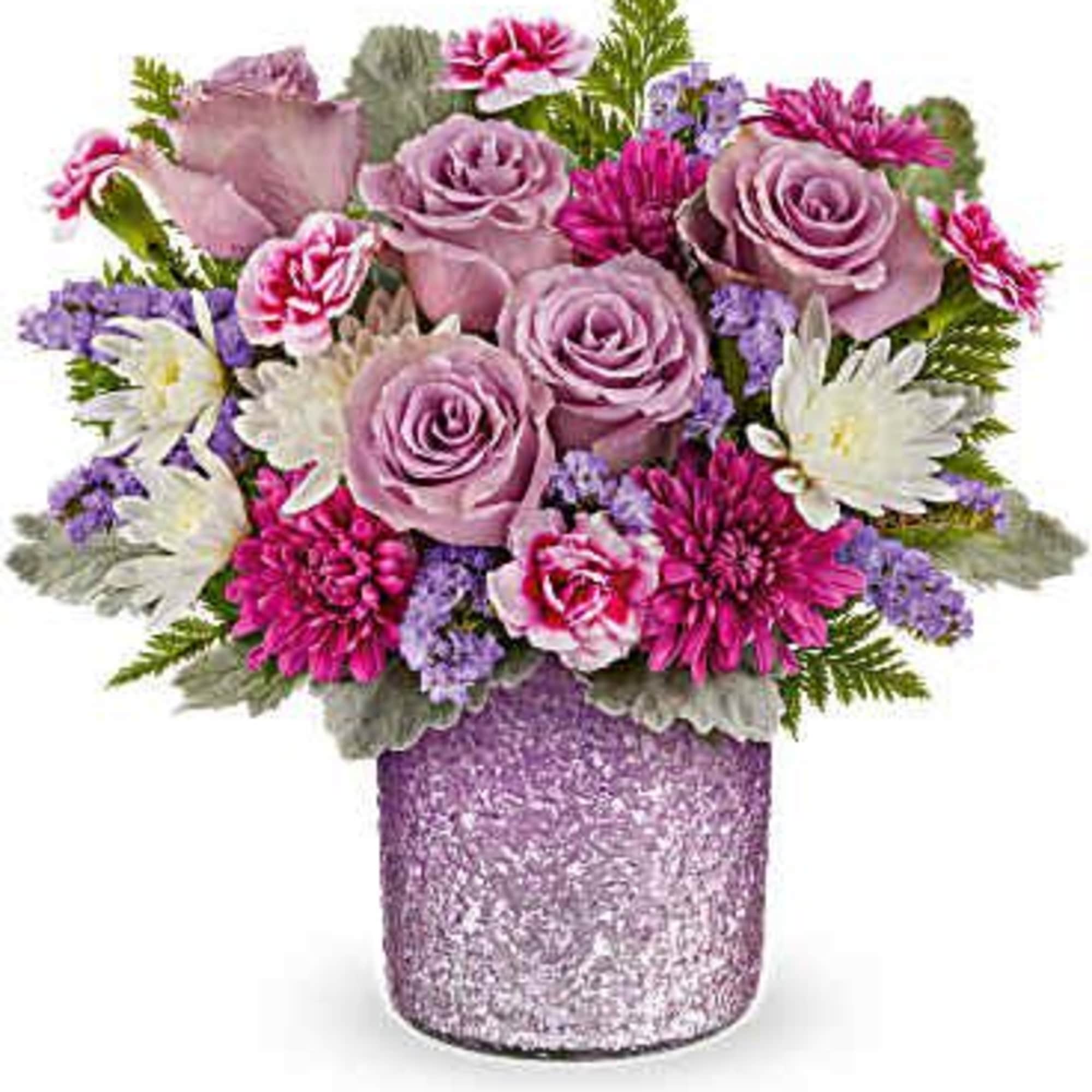 Pink and purple flower arrangement in a glittery vase