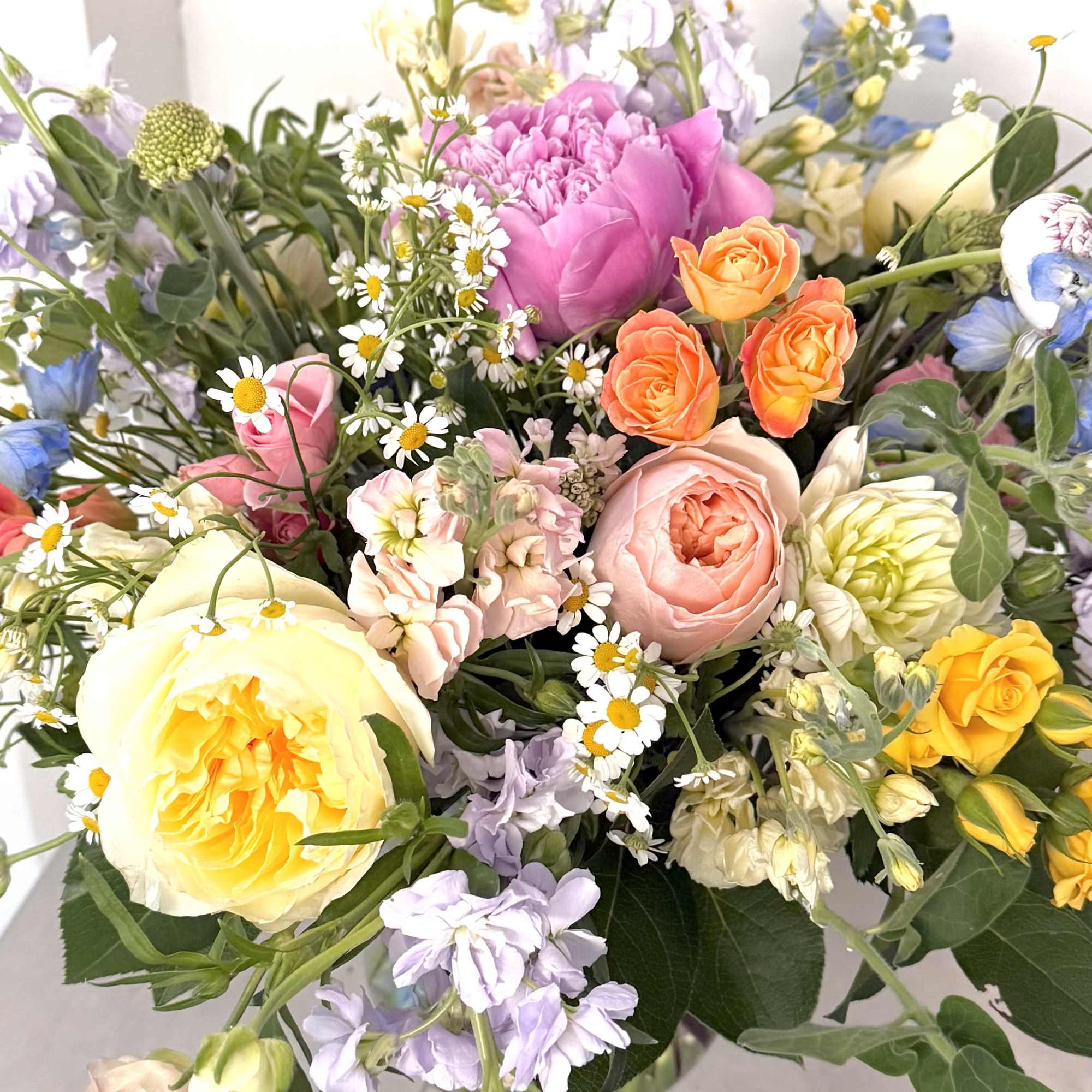 This vibrant and cheerful arrangement is a "Sunshine &amp; Wildflowers" Garden Bouquet.