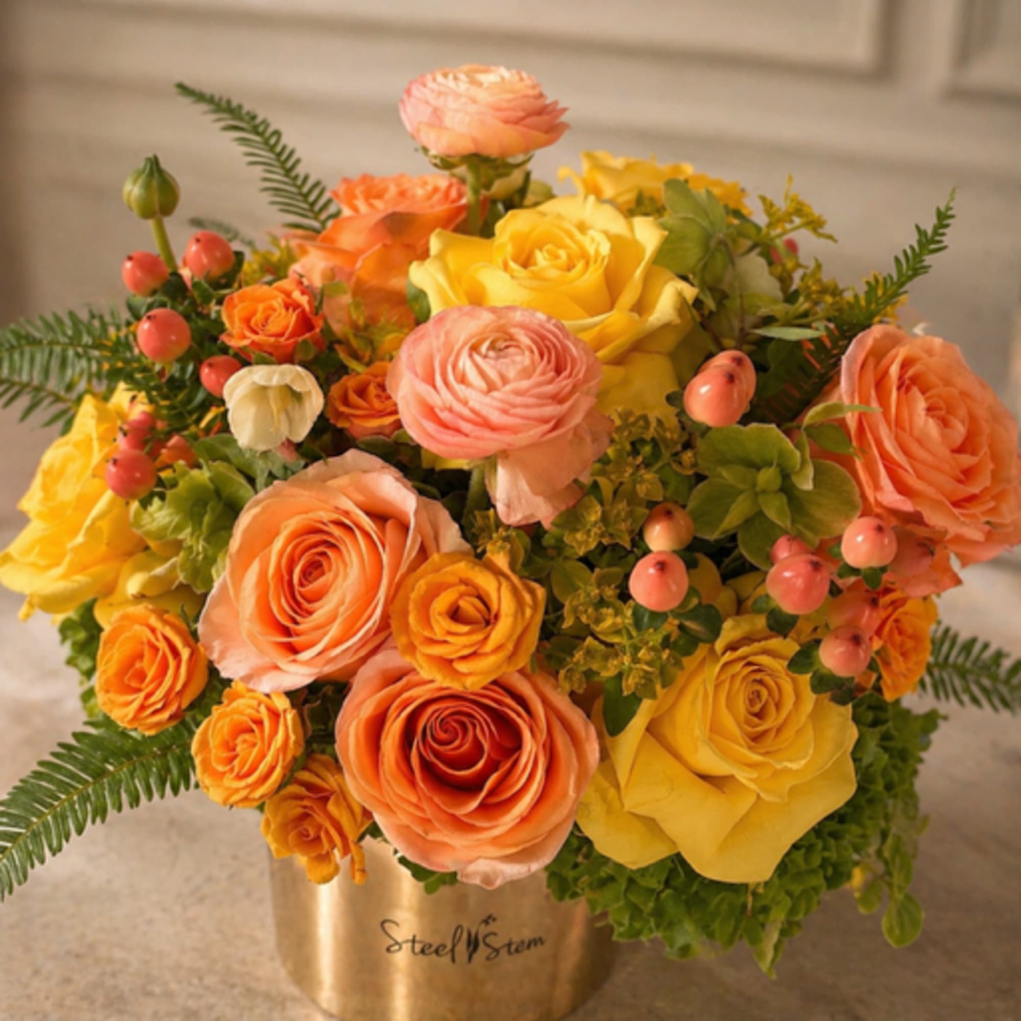 A radiant blend of golden yellows, warm peaches, and soft coral tones