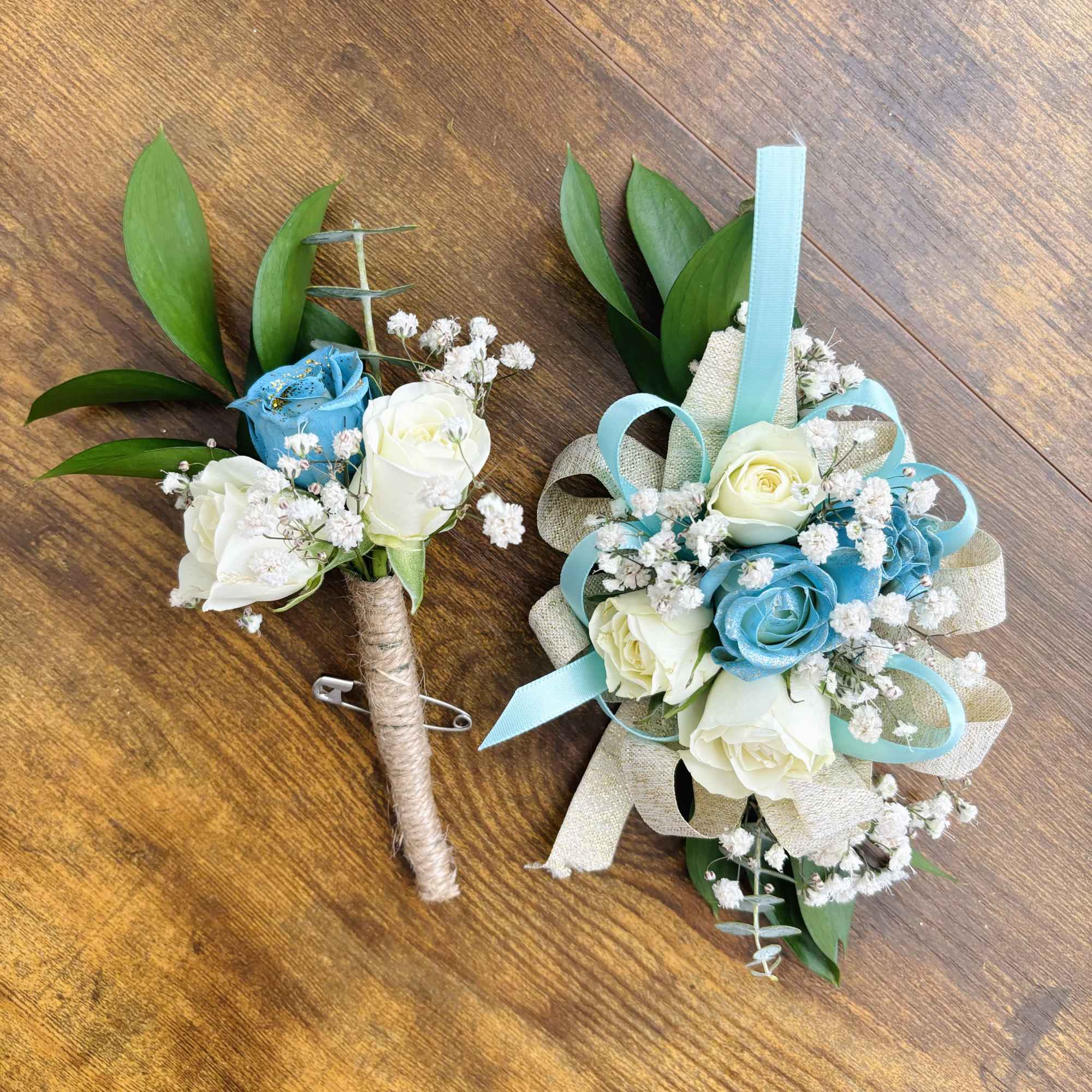 Boutonniere and matching floral wrist corsage with white and blue roses