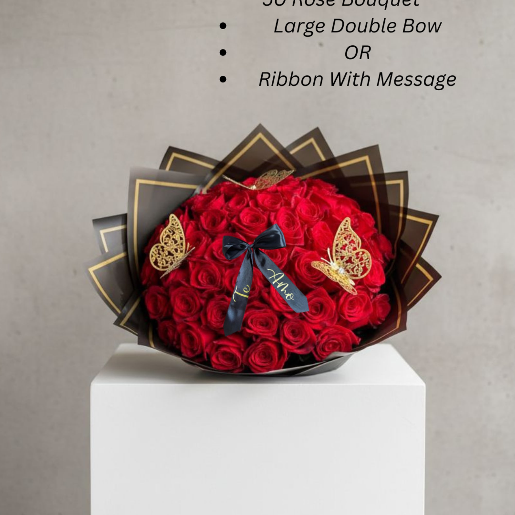 Large bouquet of red roses with a black ribbon and butterfly decorations