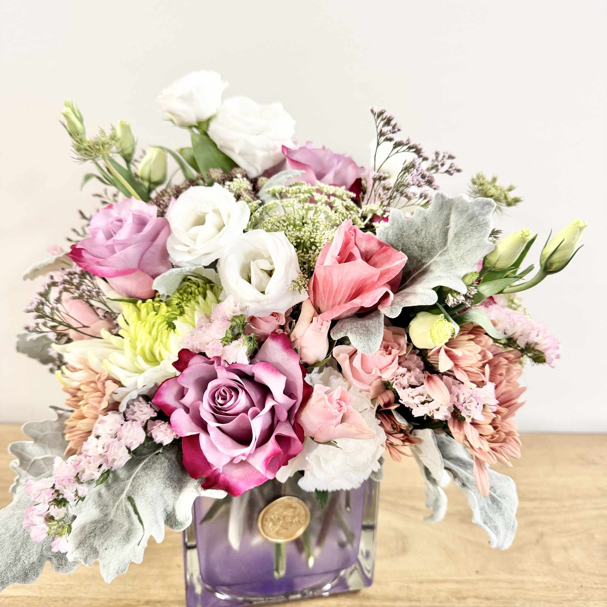 Soft Whisper is a delicate floral design arranged in a pastel cube