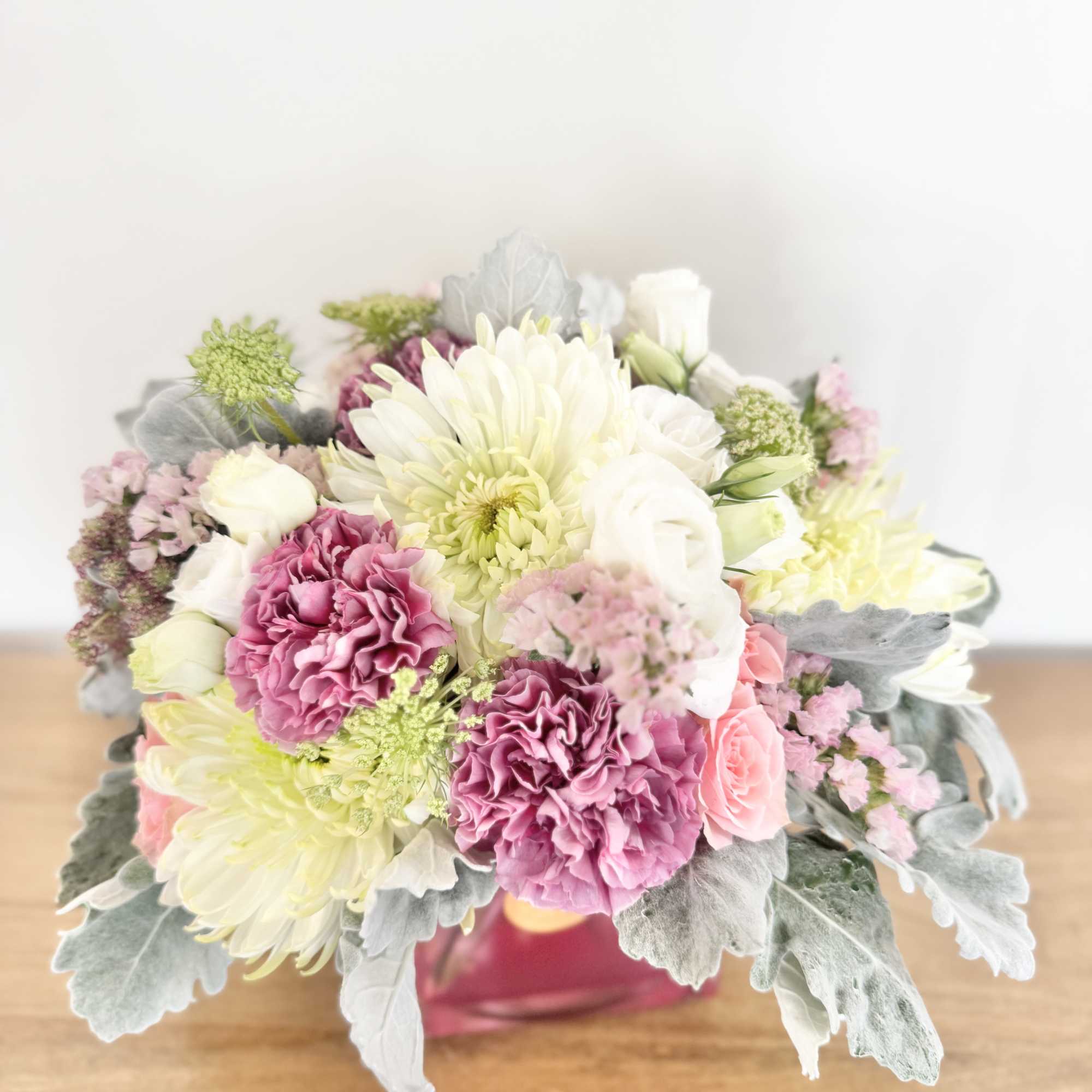 Soft Whisper is a delicate floral design arranged in a pastel cube