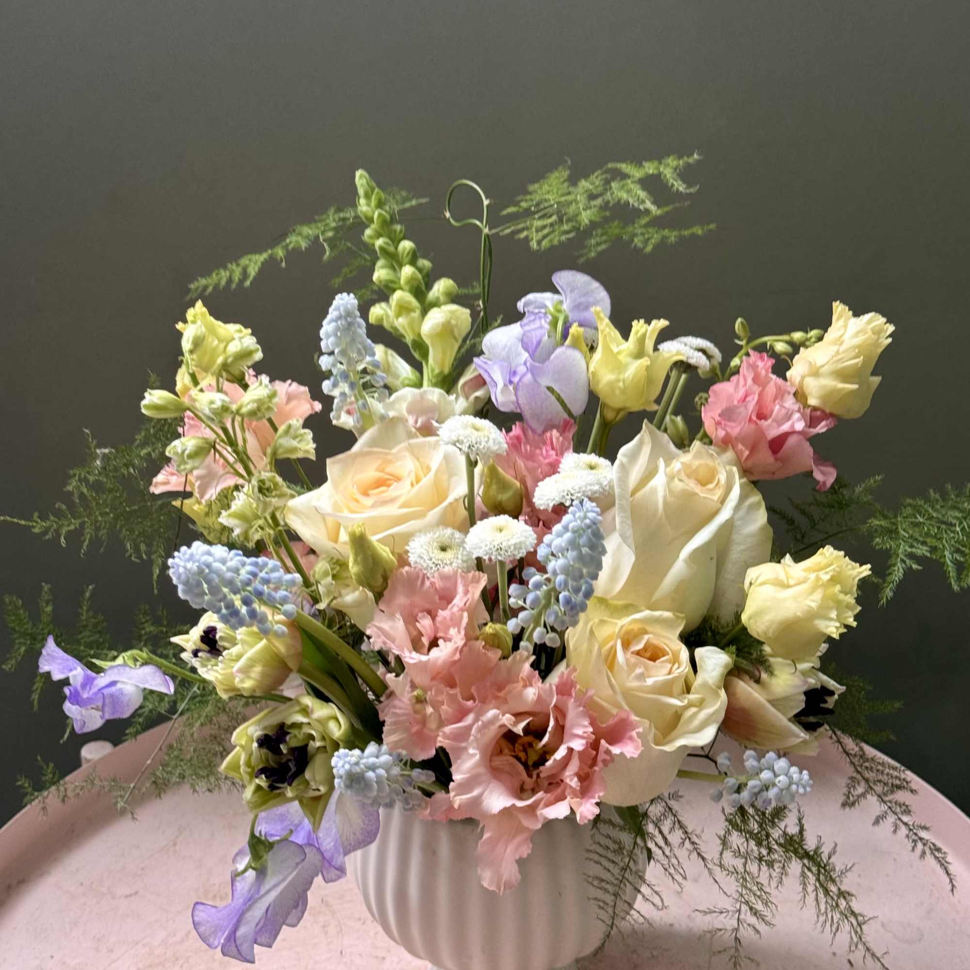 Soft pastels and a garden-fresh feel make this birthday bouquet or Mother's