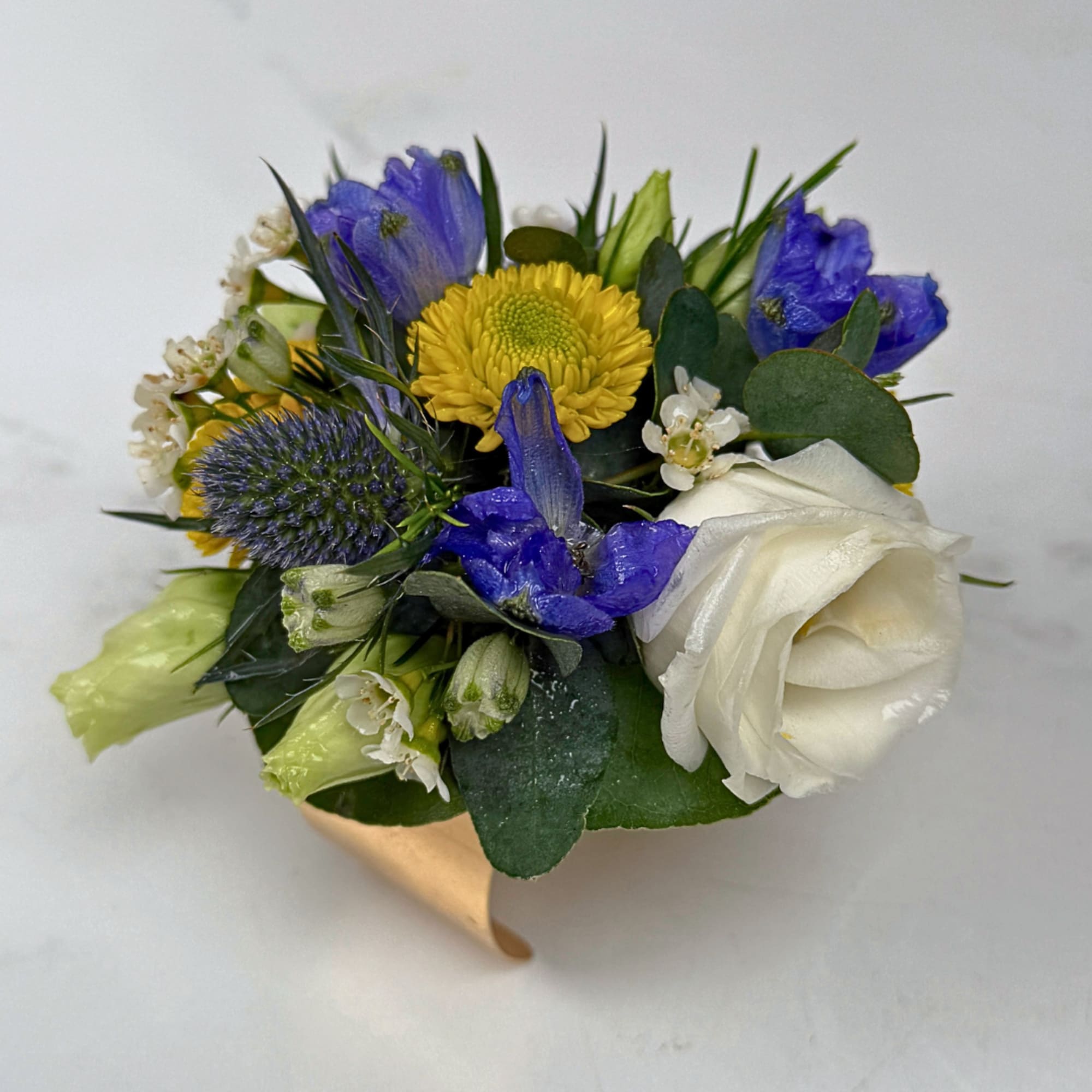 A bright, compact wrist corsage that turns any prom, wedding, or special-occasion