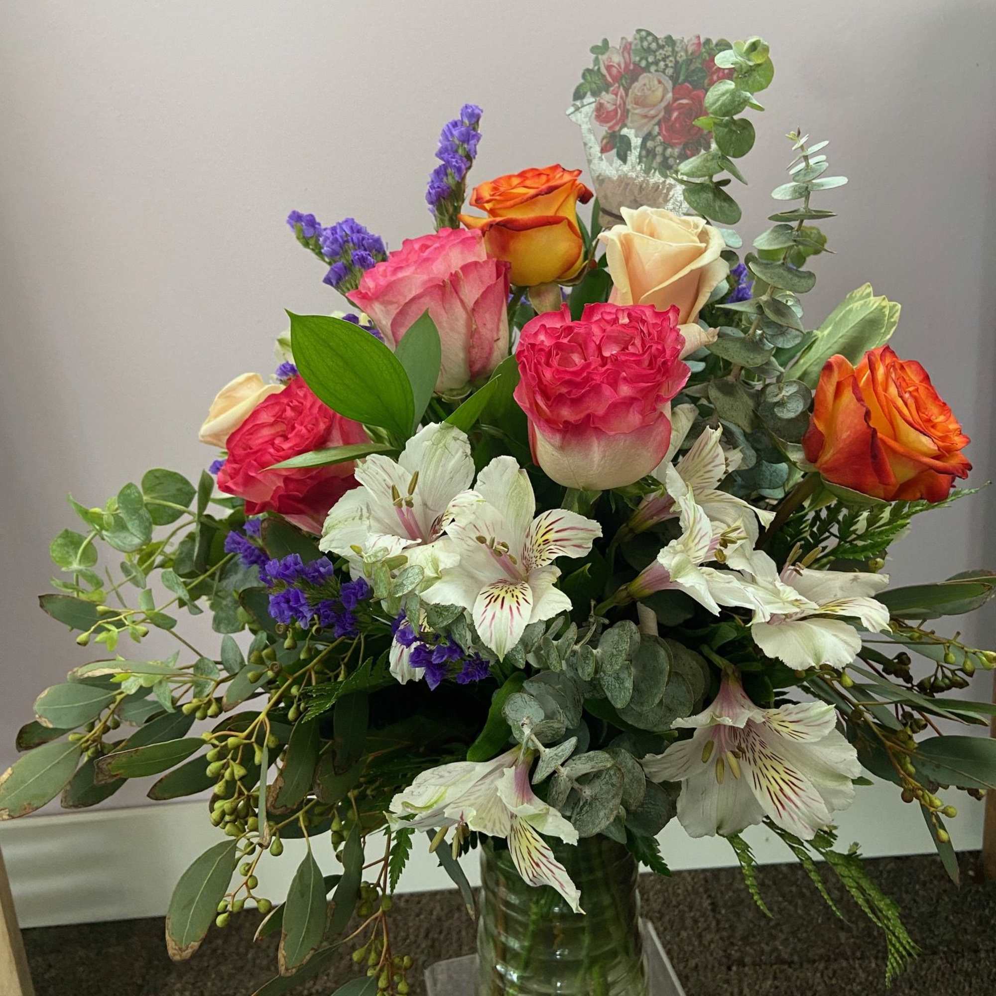A beautiful mix of roses, alstroemeria, statice, and greens to show how