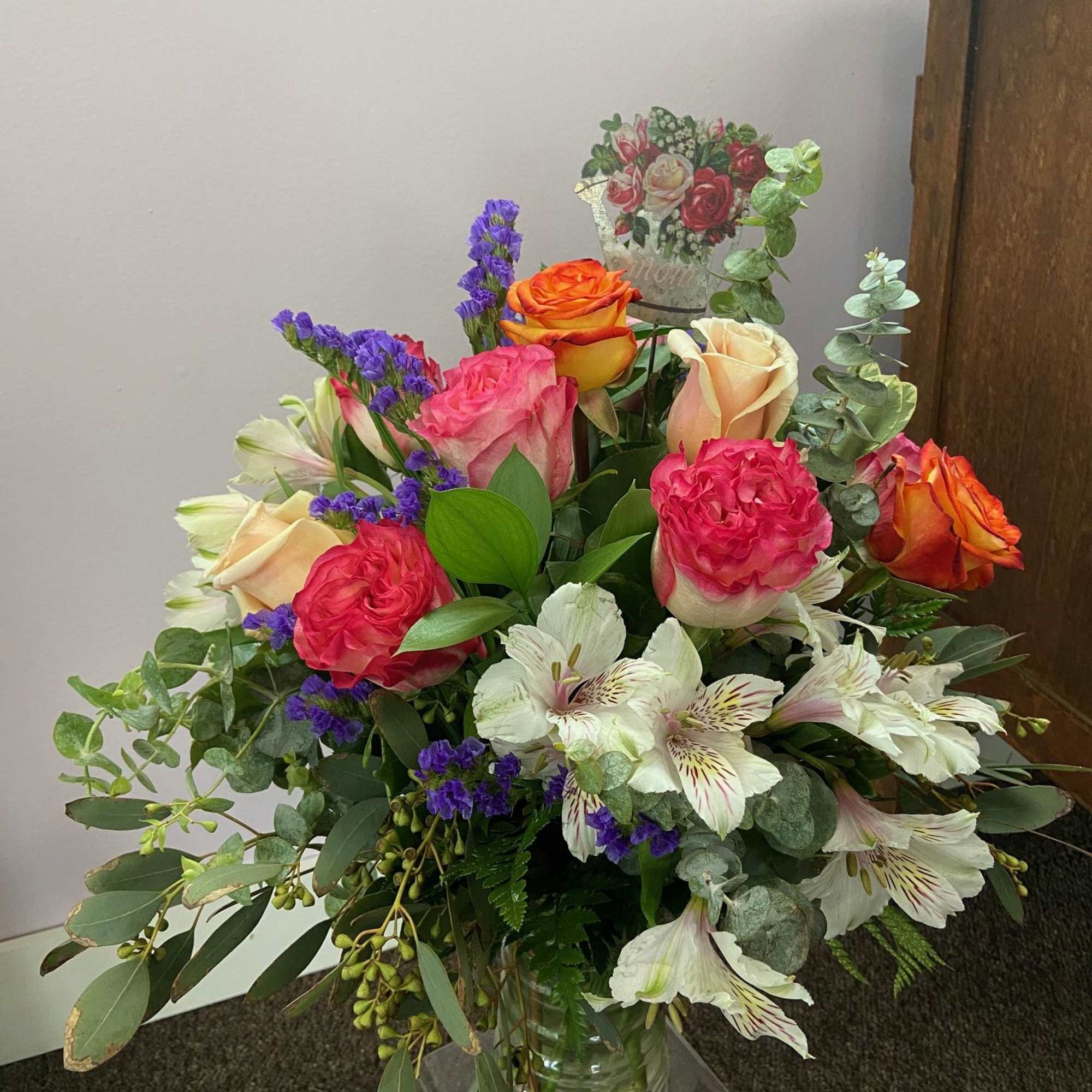 A beautiful mix of roses, alstroemeria, statice, and greens to show how