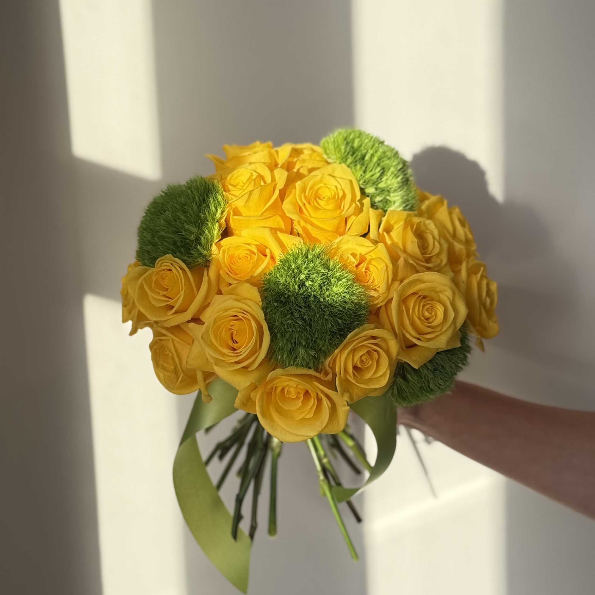 Yellow rose bouquet with green pom-pom accents