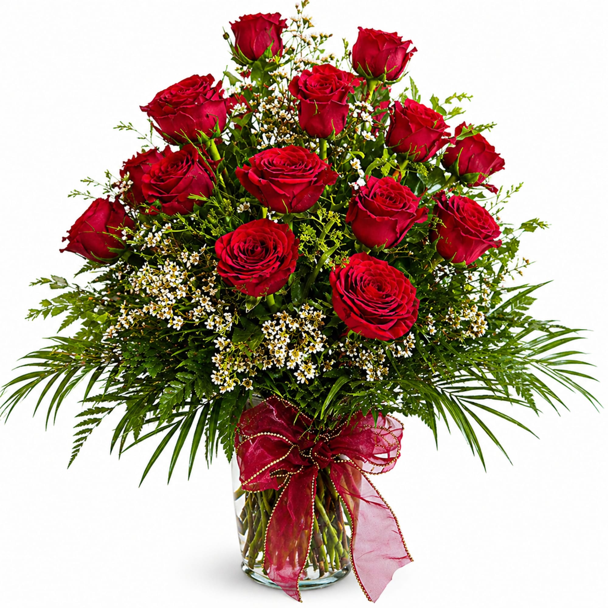 A clustered tower of deep red roses rises above a cloud of