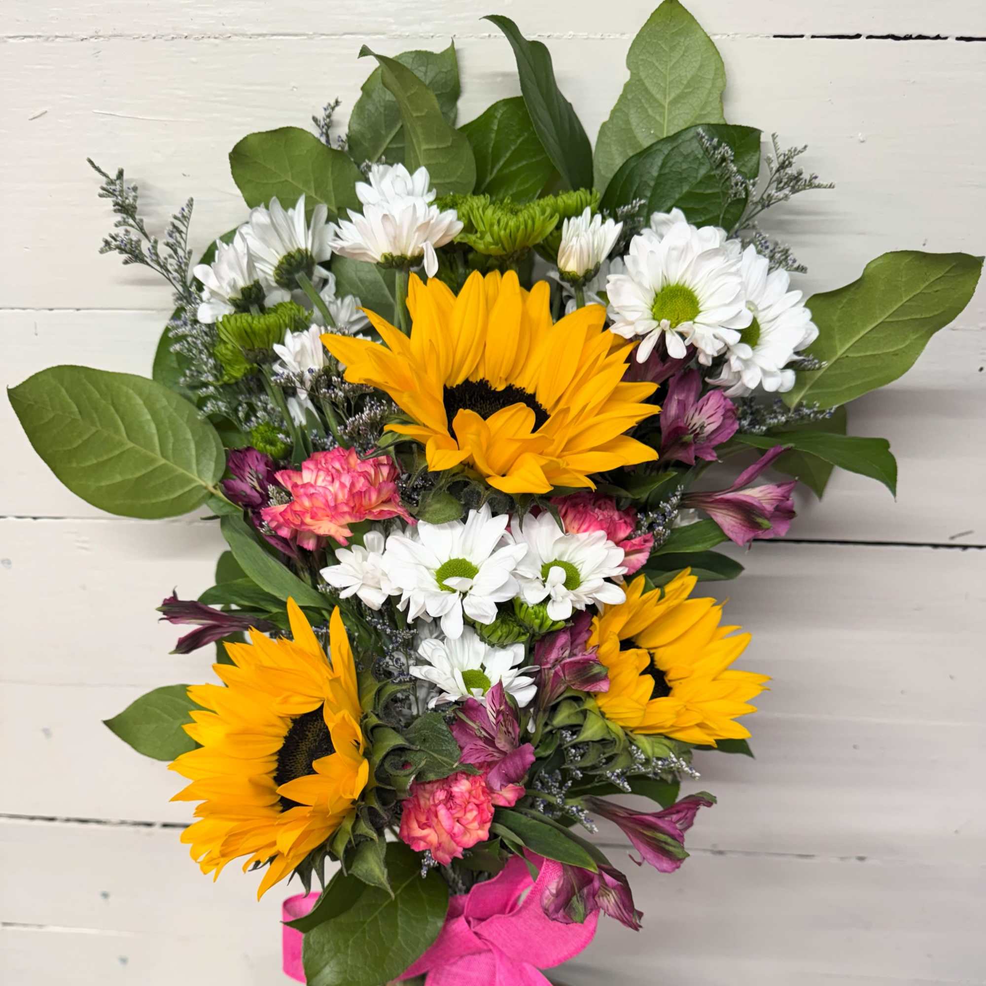 Bouquet with sunflowers, white daisies, and pink flowers