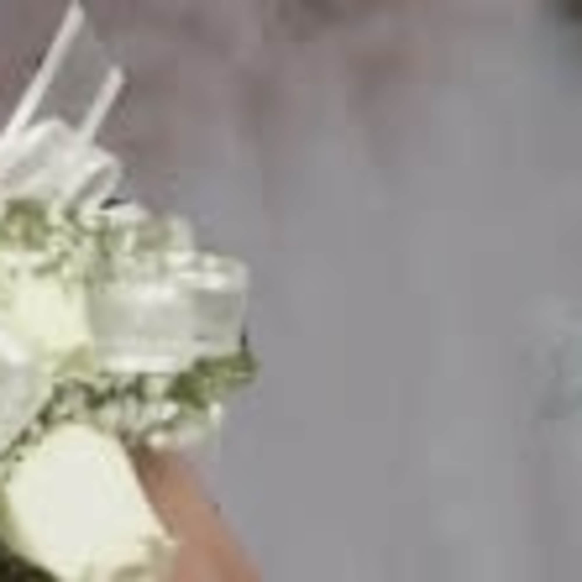 White rose bouquets with ribbon accents