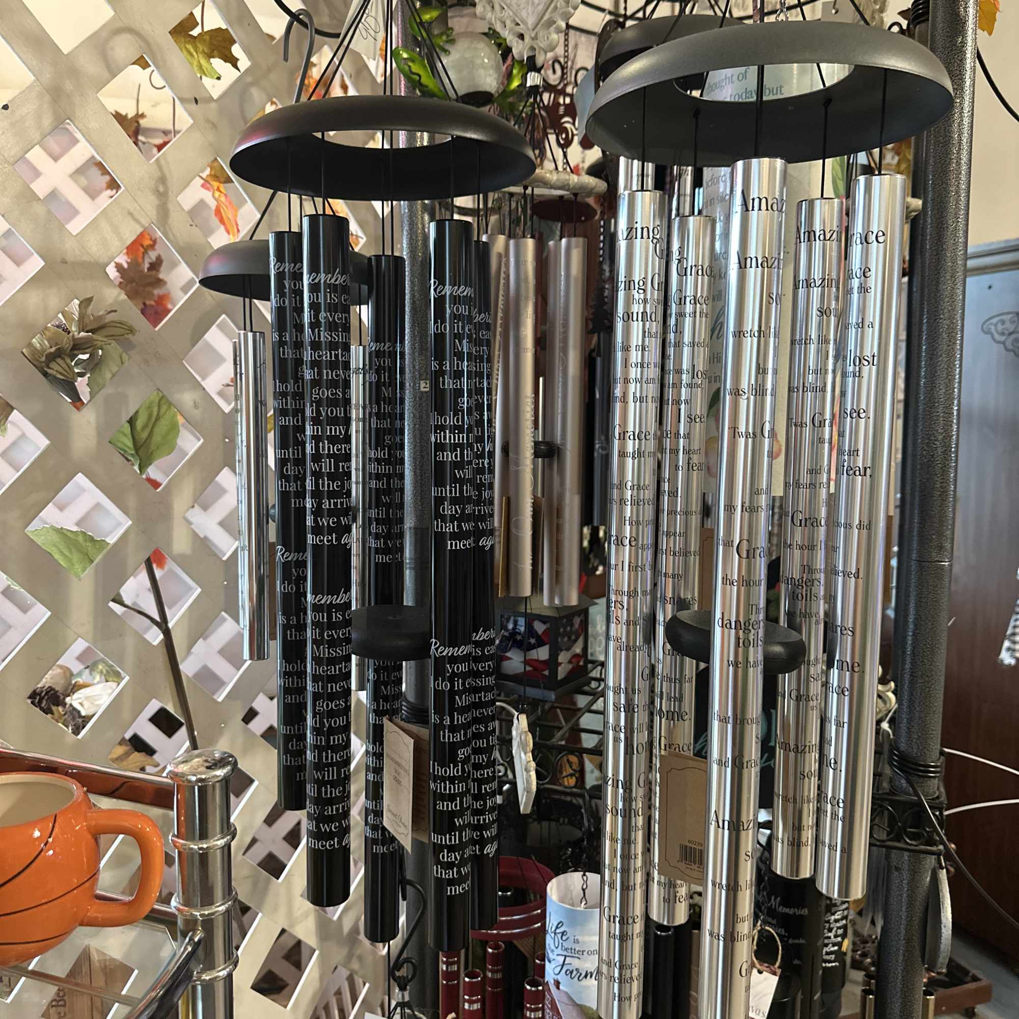 Hanging memorial wind chimes with engraved tubes and black tops