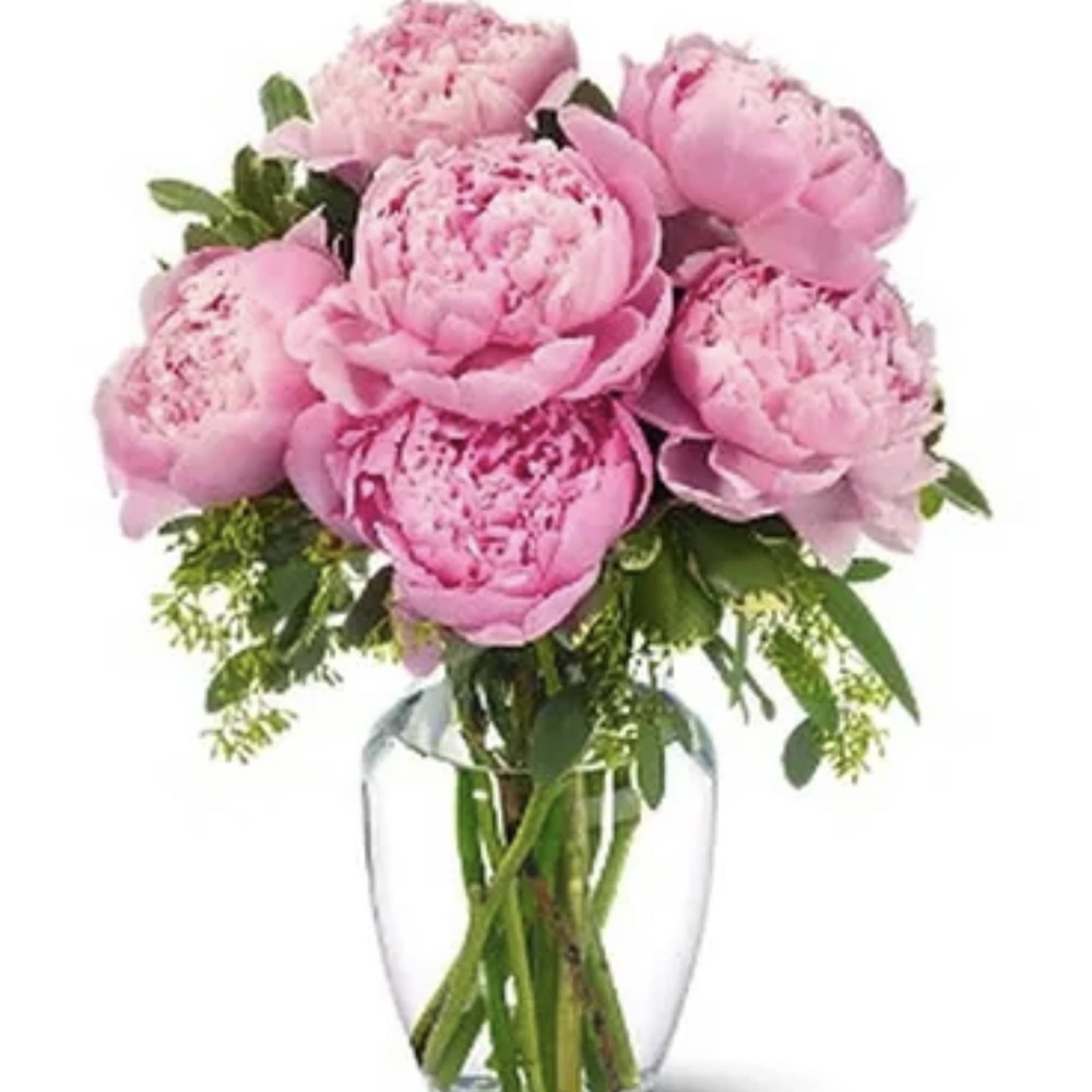 Pink peonies arranged in a clear glass vase