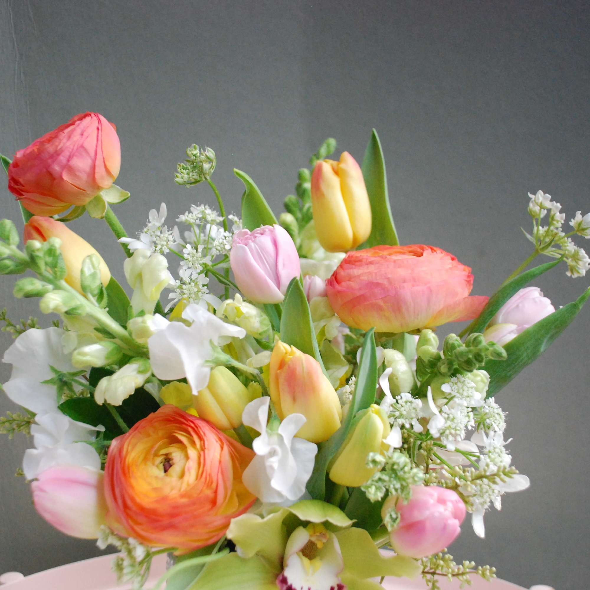 Bold, sculptural and joyfully colorful, this floral arrangement-perfect as a birthday bouquet