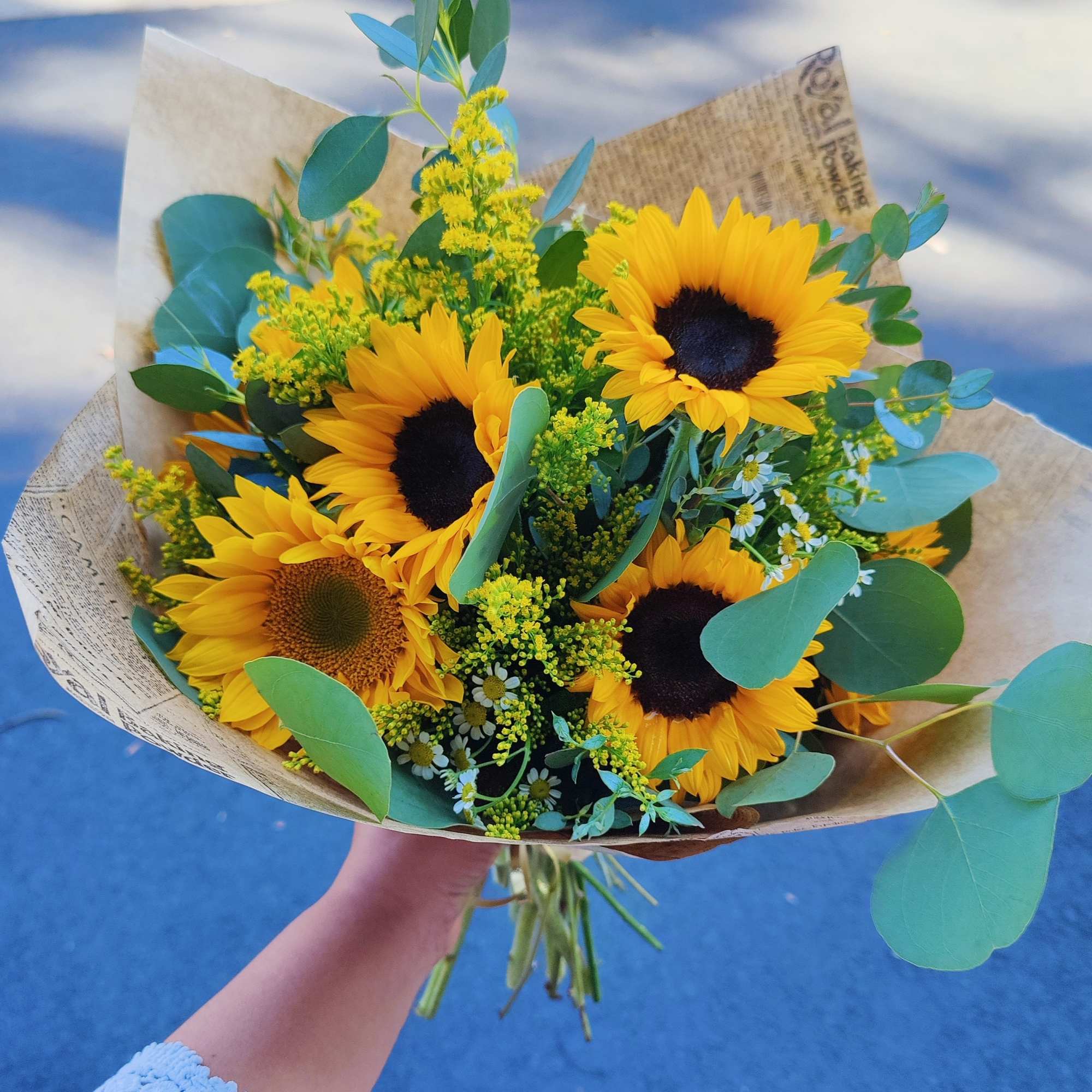 Bouquet of sunflowers with eucalyptus and yellow filler flowers