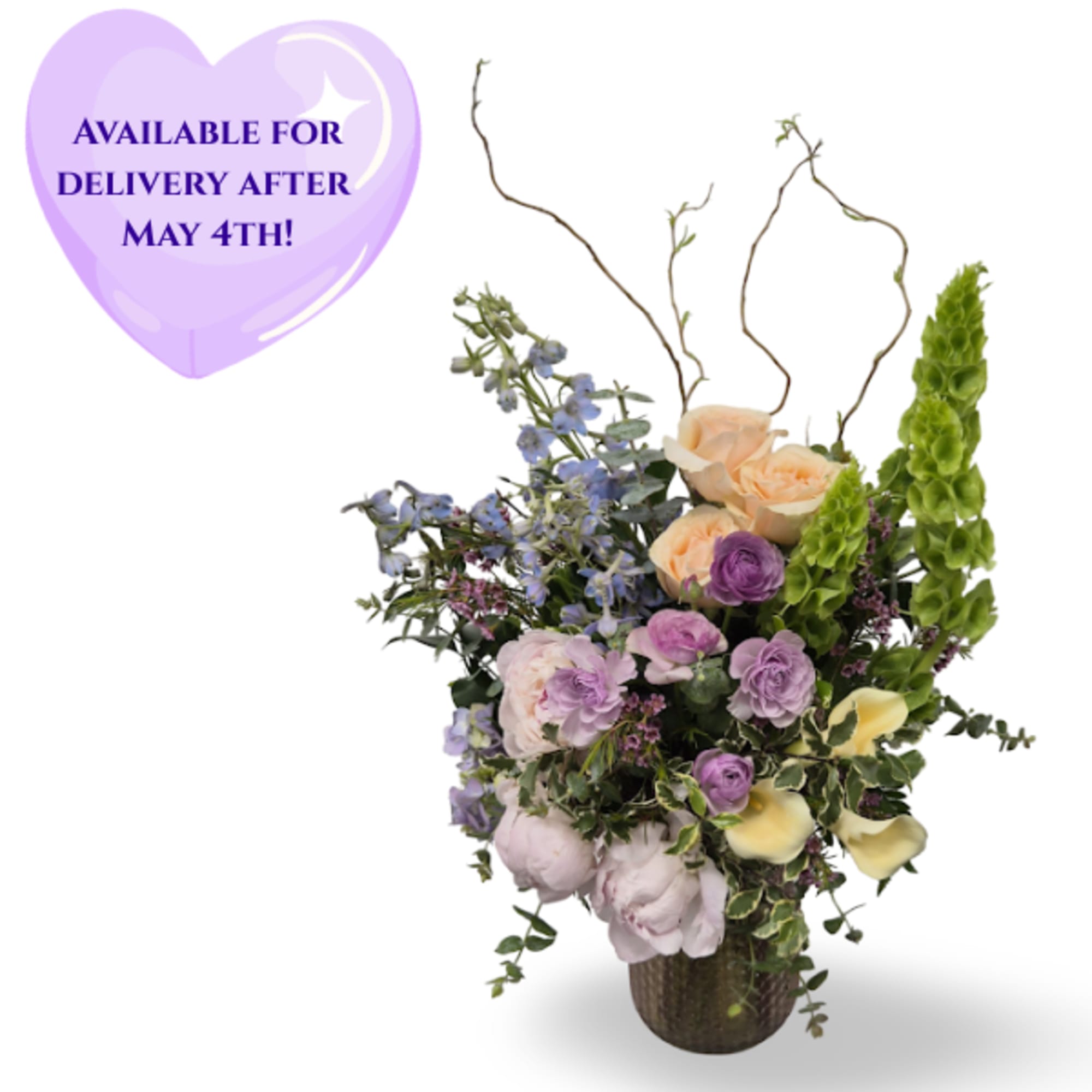 Soft lavender delphinium and pale yellow calla lilies lift a cascade of