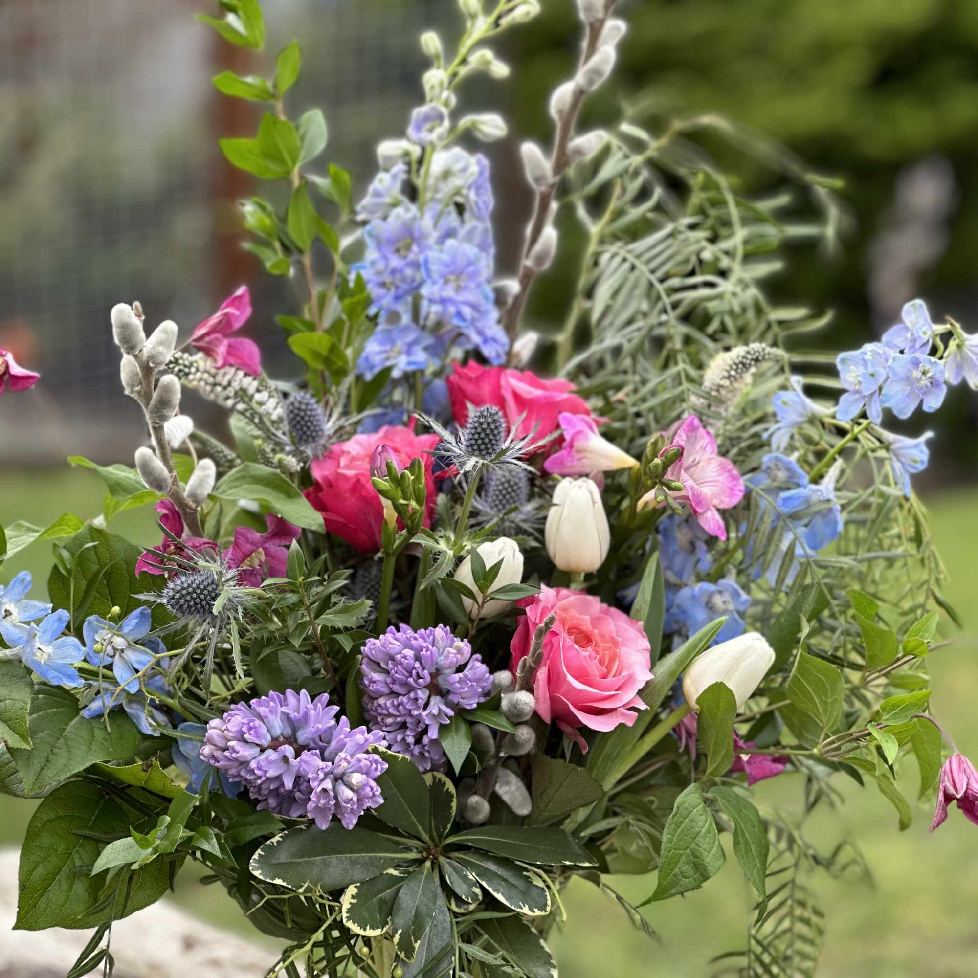 Mixed bouquet with pink, purple, blue, and white flowers