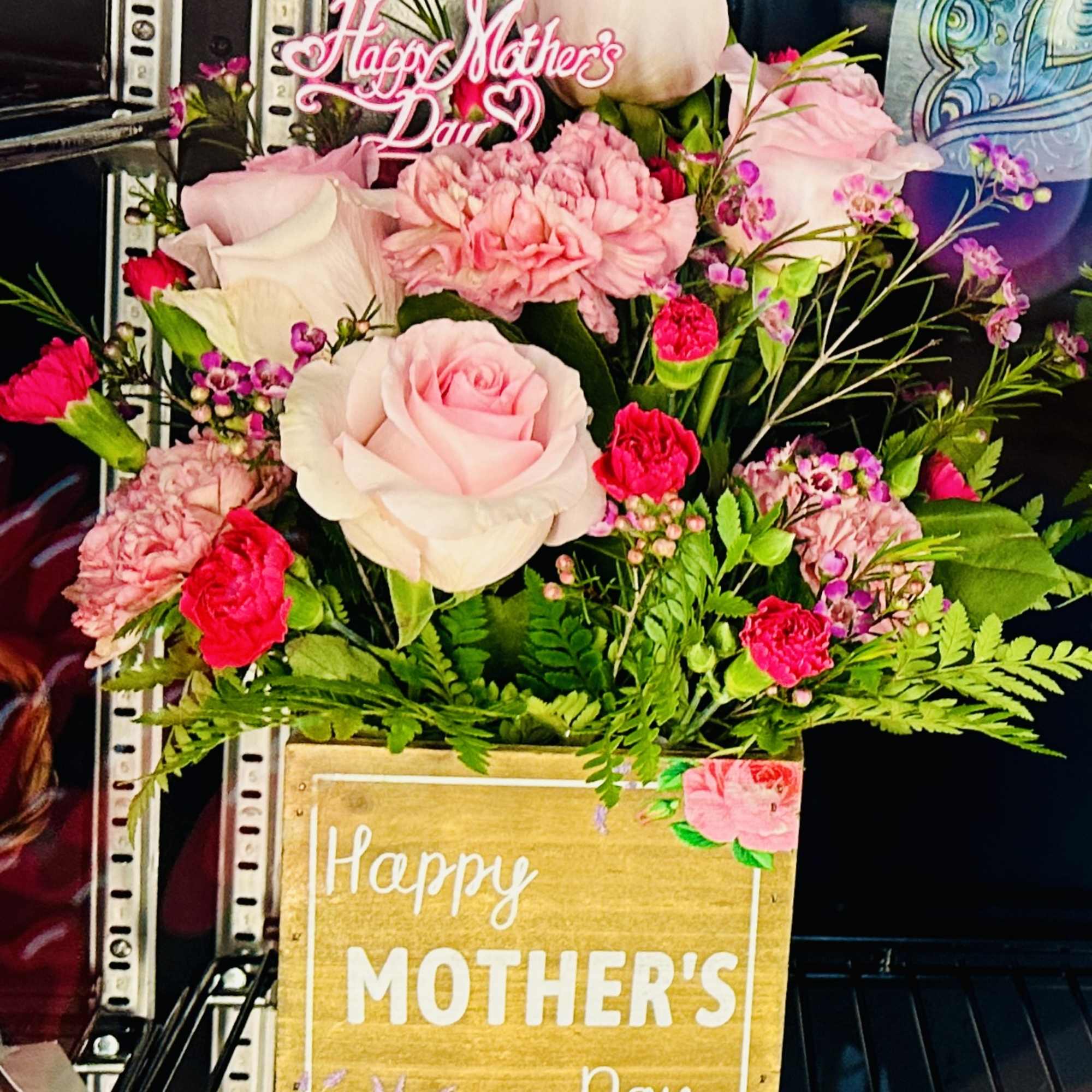 A magnificent Mother&rsquo;s Day Designer&rsquo;s Choice Arrangement* displayed in a keepsake container.