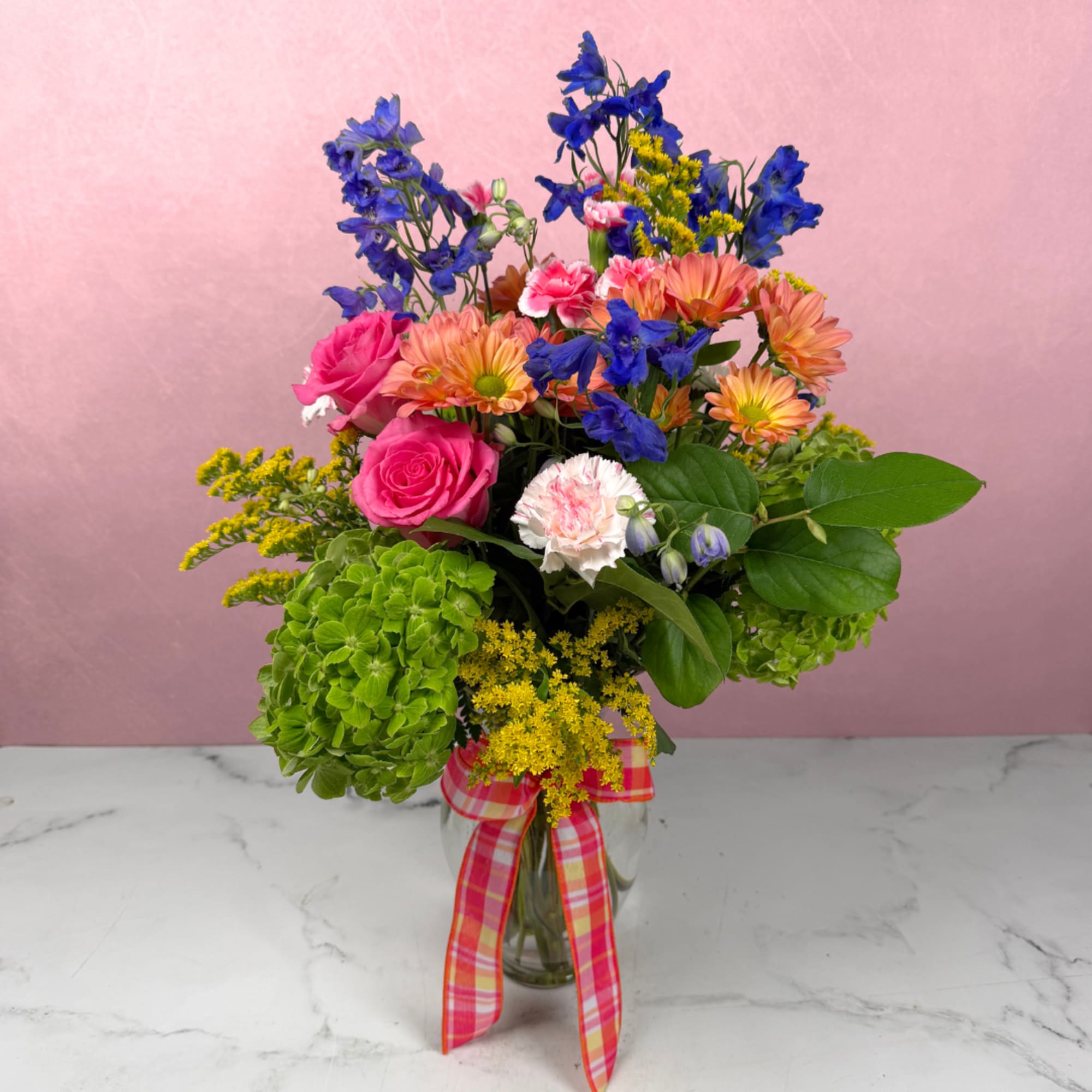 Make someone's day with our Spring Surprise! This lovely arrangement is a