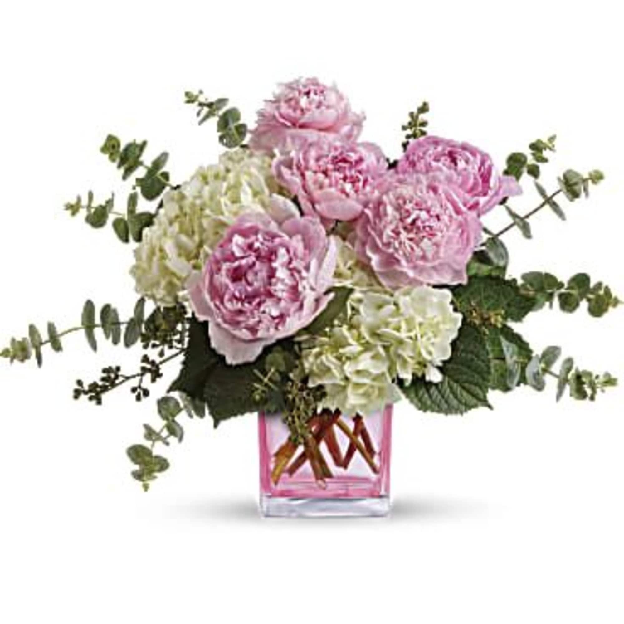 Big beautiful pink peony blossoms, brilliant white hydrangea and two kinds of