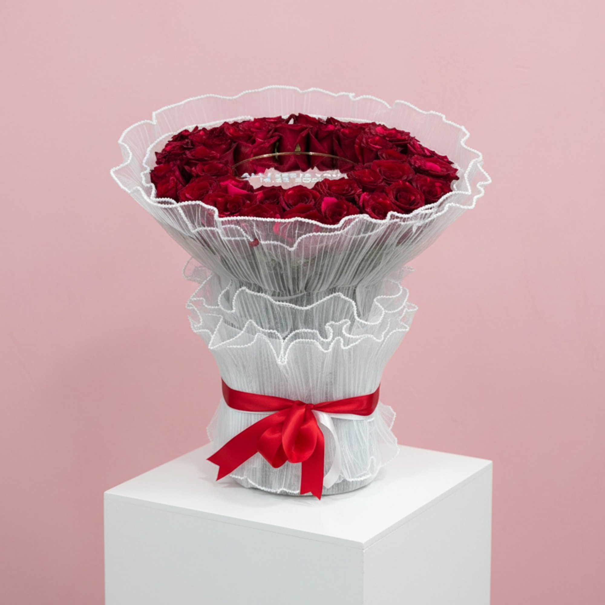 A dramatic ring of deep red roses arranged in a perfect circular