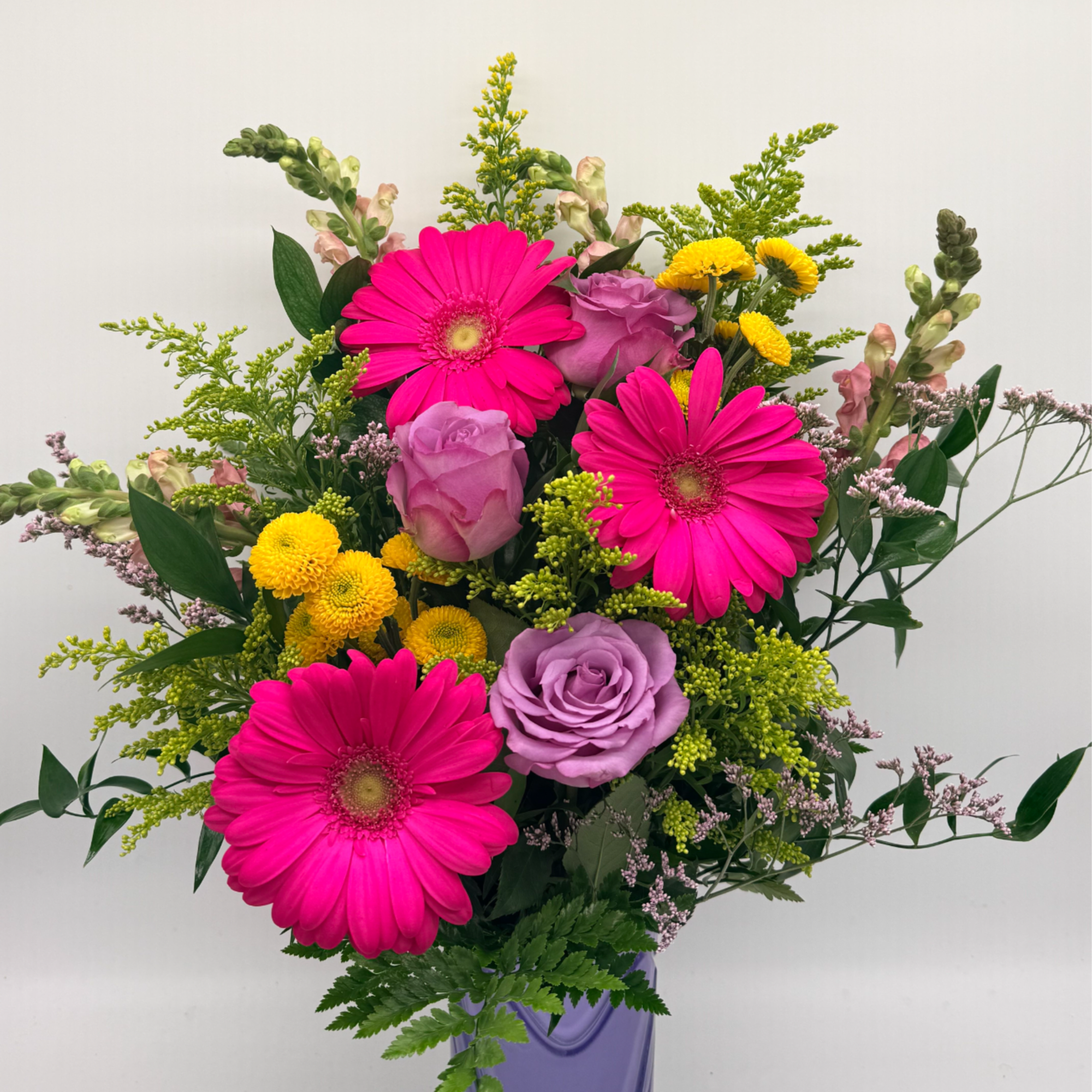 A fun and flirty mix of pinks, purples, and sunny yellows arranged