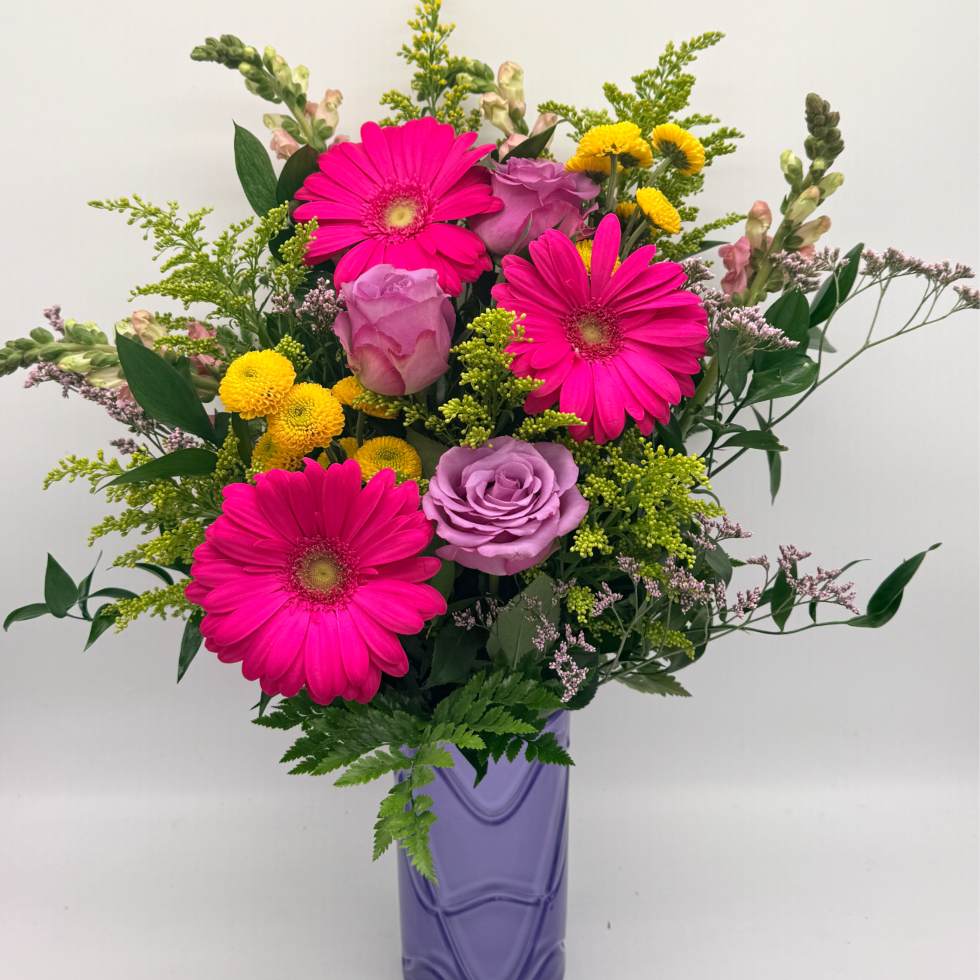 A fun and flirty mix of pinks, purples, and sunny yellows arranged