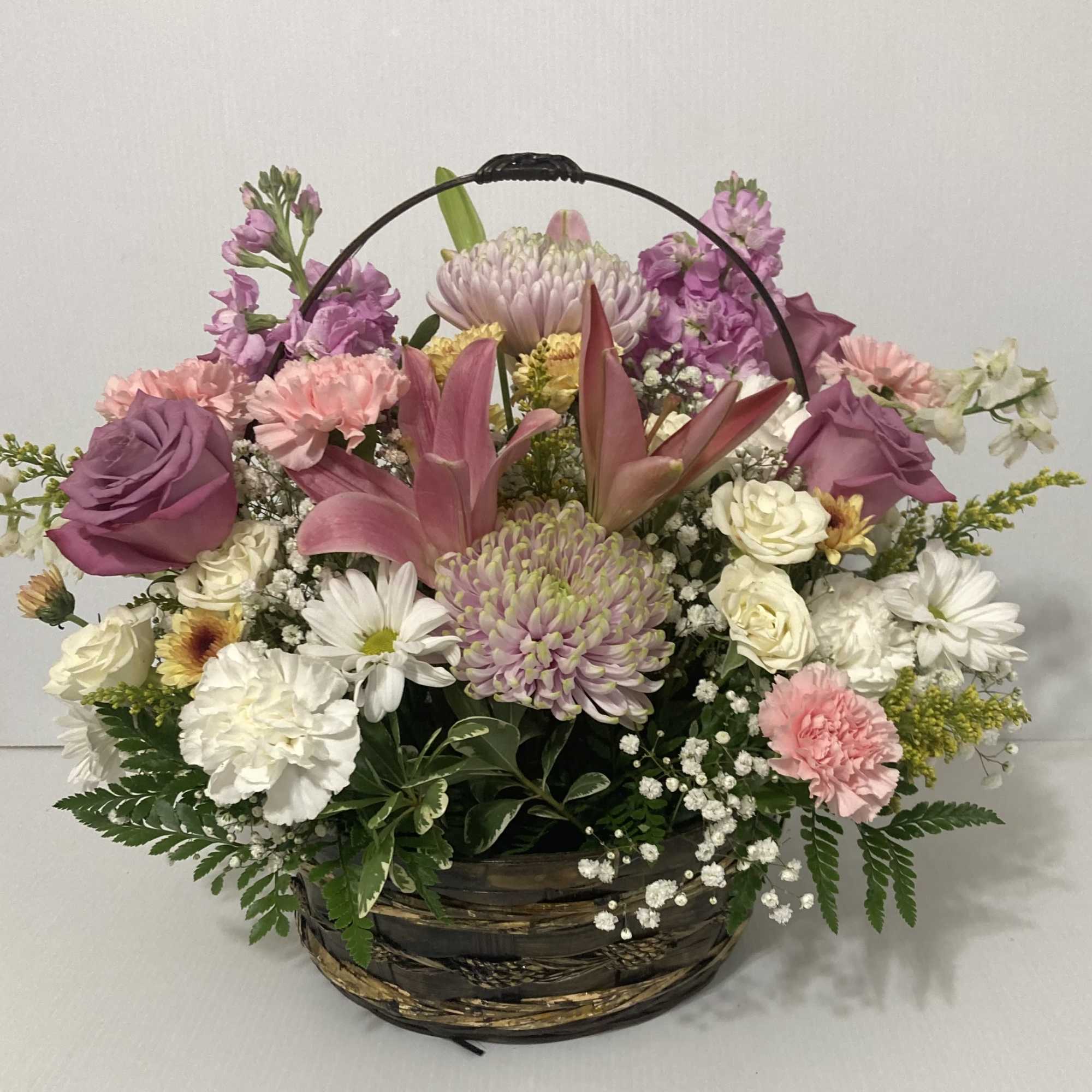 Beautiful Arrangement perfect for Mothers Day which includes Lilies, Roses, Carnations, Daisies