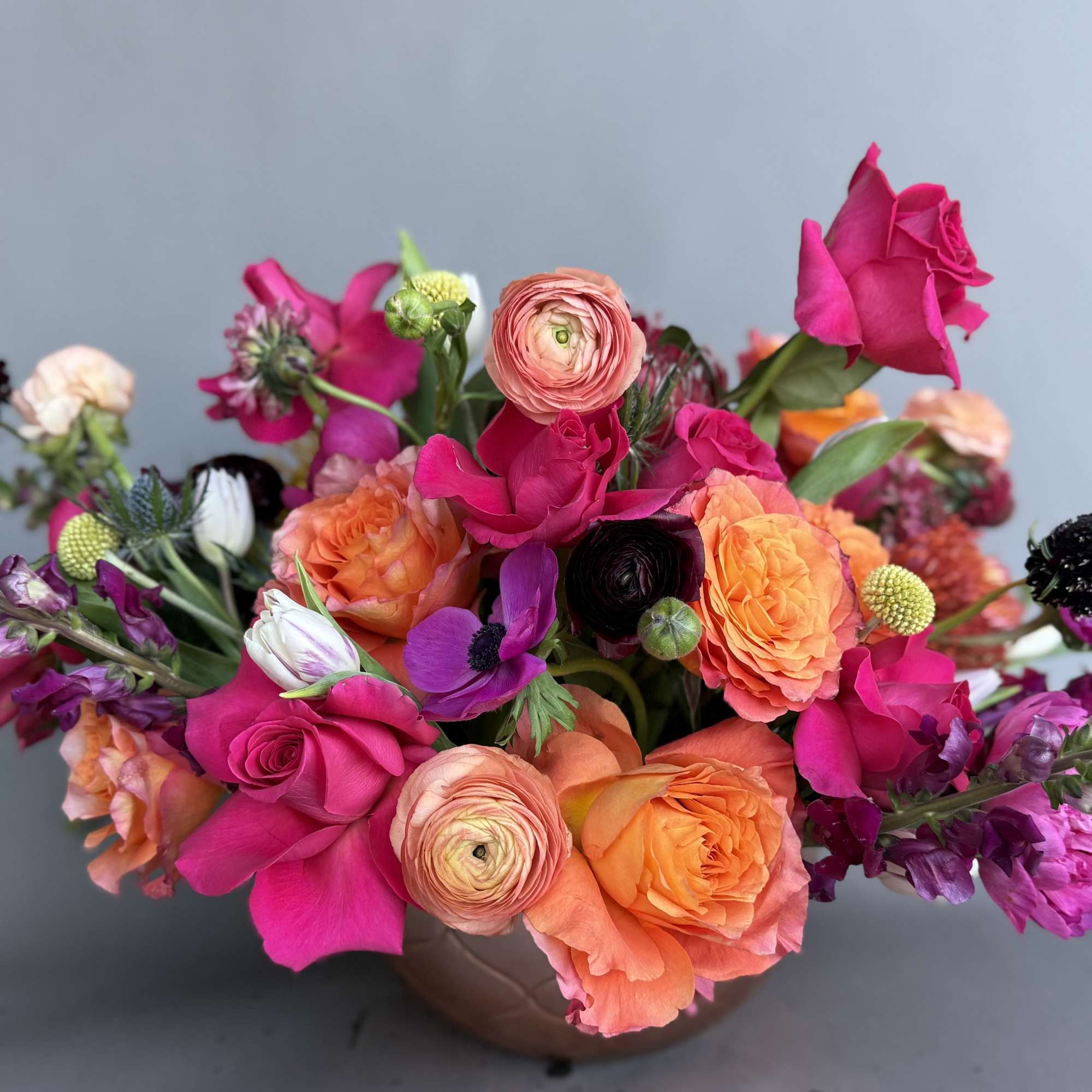 
We will design with the same stunning flowers you see minus peonies.