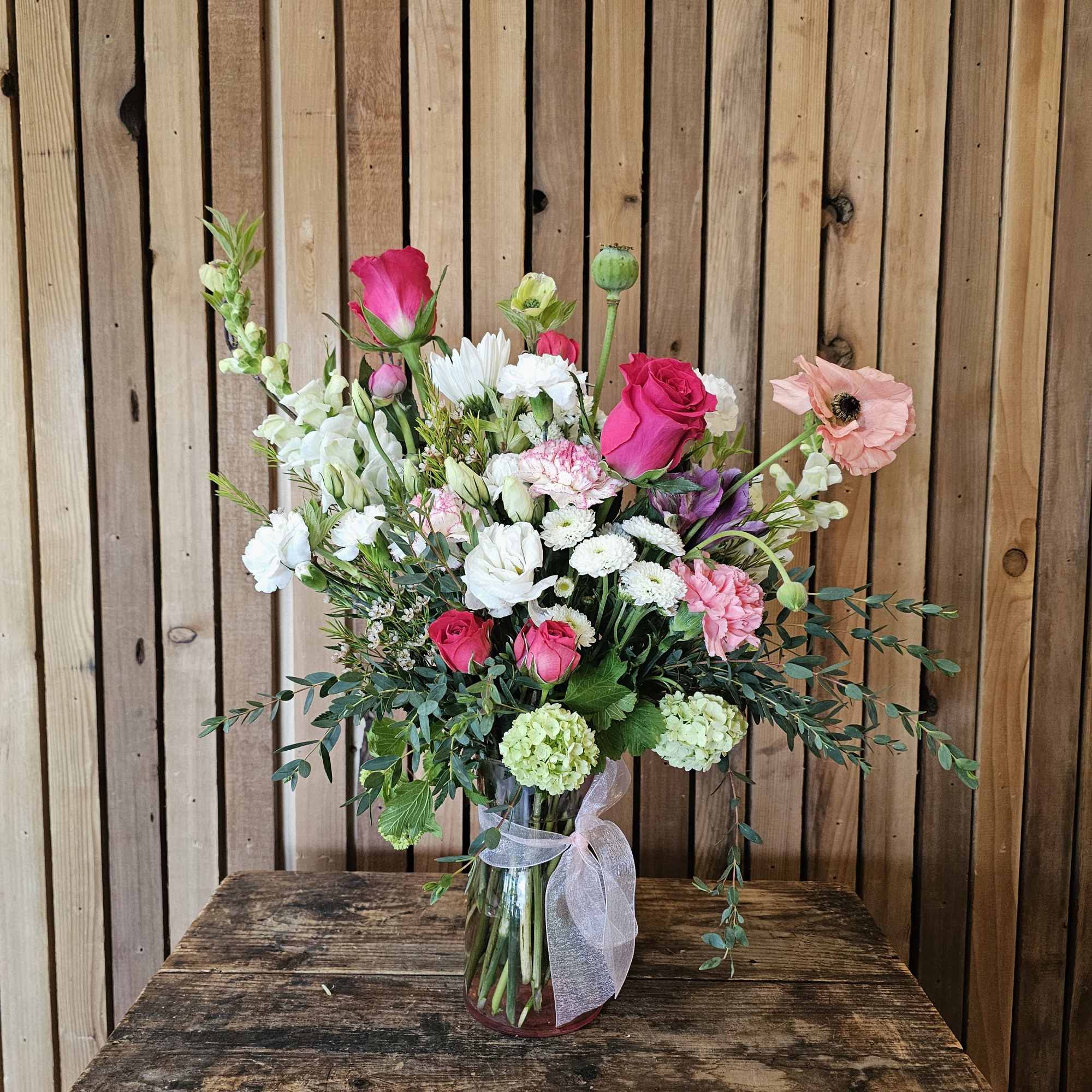 Layers of pink, white, and lavender blooms with touches of bright pink