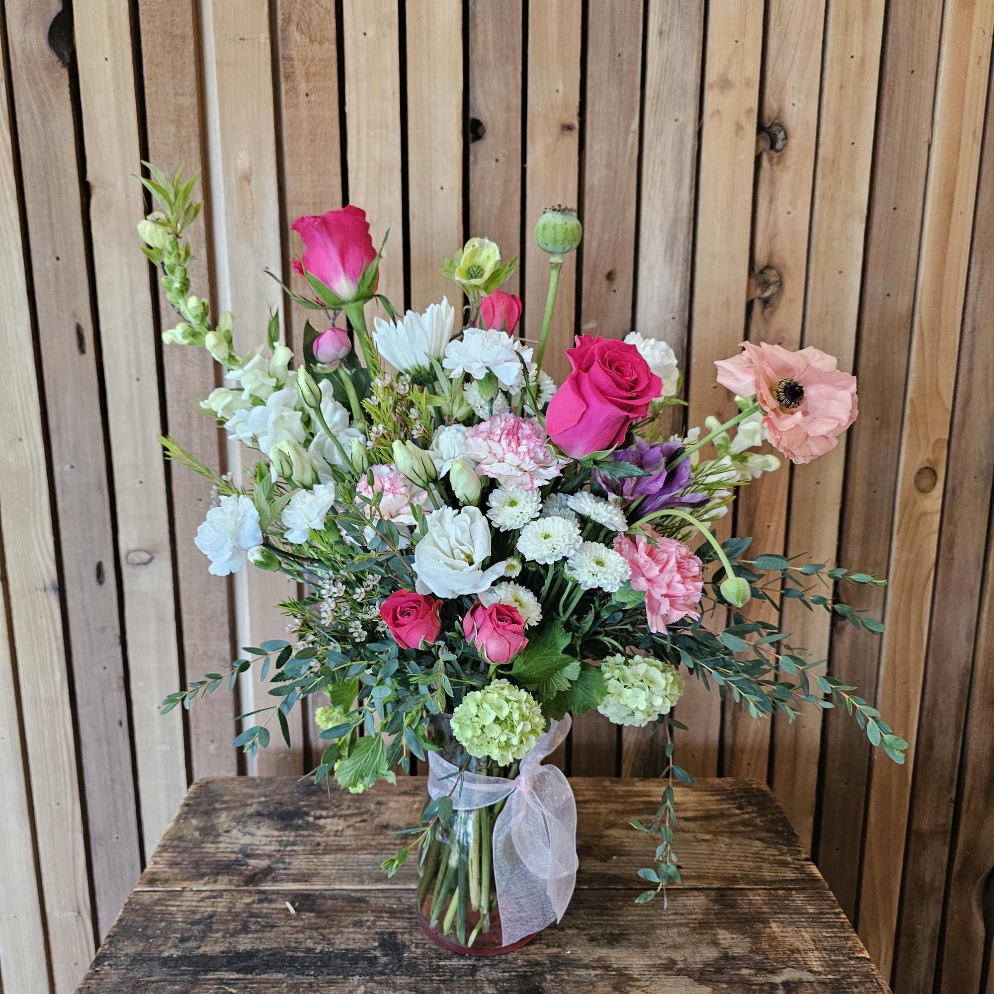 Layers of pink, white, and lavender blooms with touches of bright pink