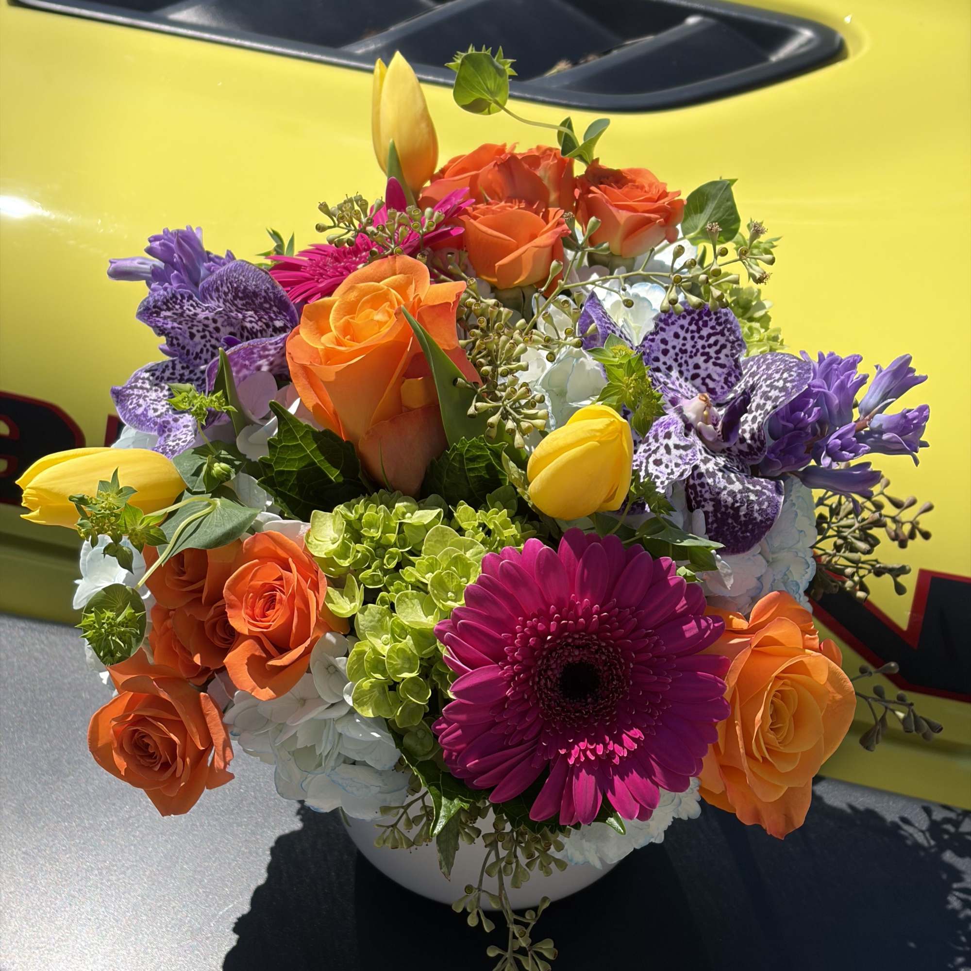 A vivid celebration in bloom, Day Dreaming is a mixed-color bouquet built