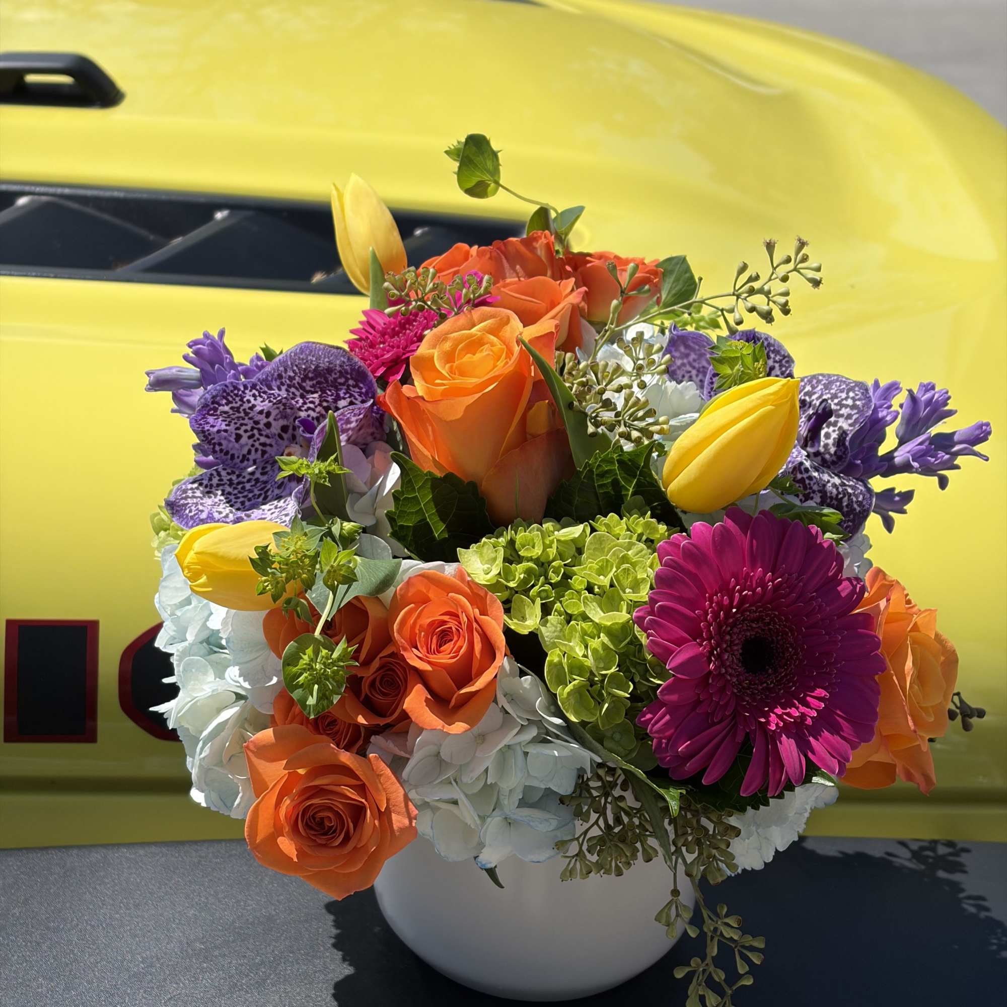 A vivid celebration in bloom, Day Dreaming is a mixed-color bouquet built