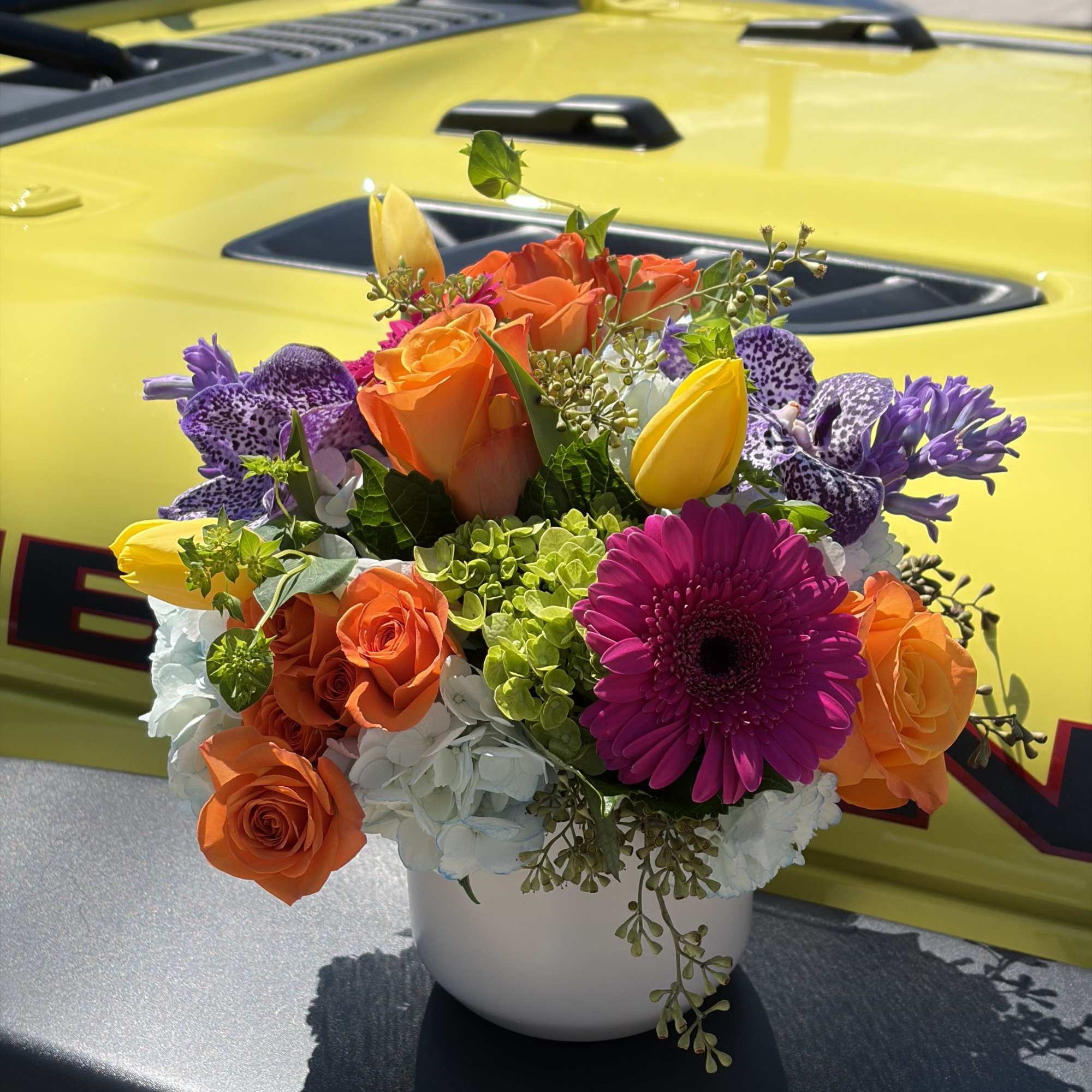 A vivid celebration in bloom, Day Dreaming is a mixed-color bouquet built