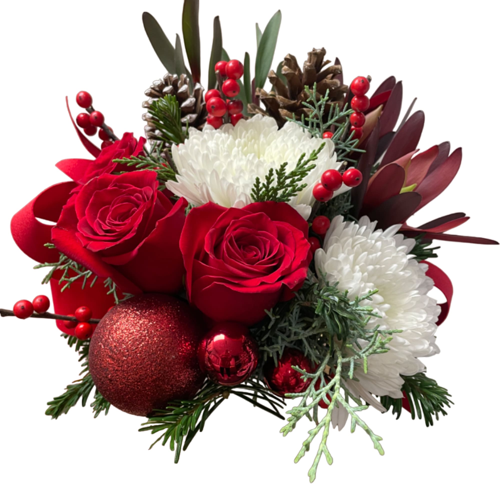 Red roses and white chrysanthemums with holiday berries and ornaments