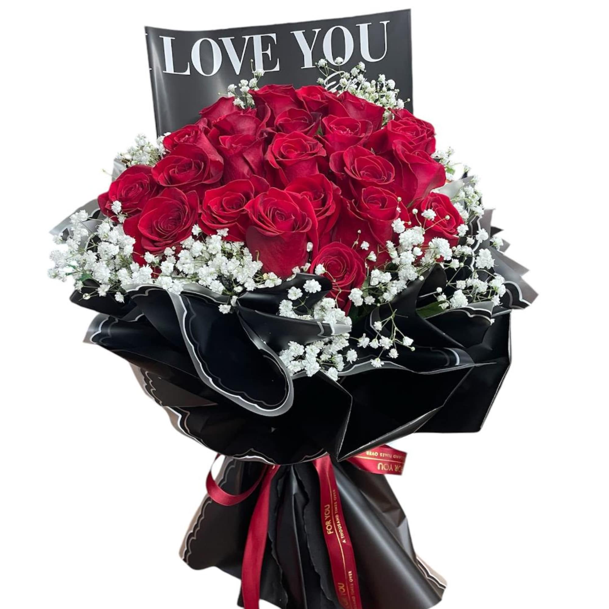 Bouquet of red roses with white baby's breath and a LOVE YOU sign