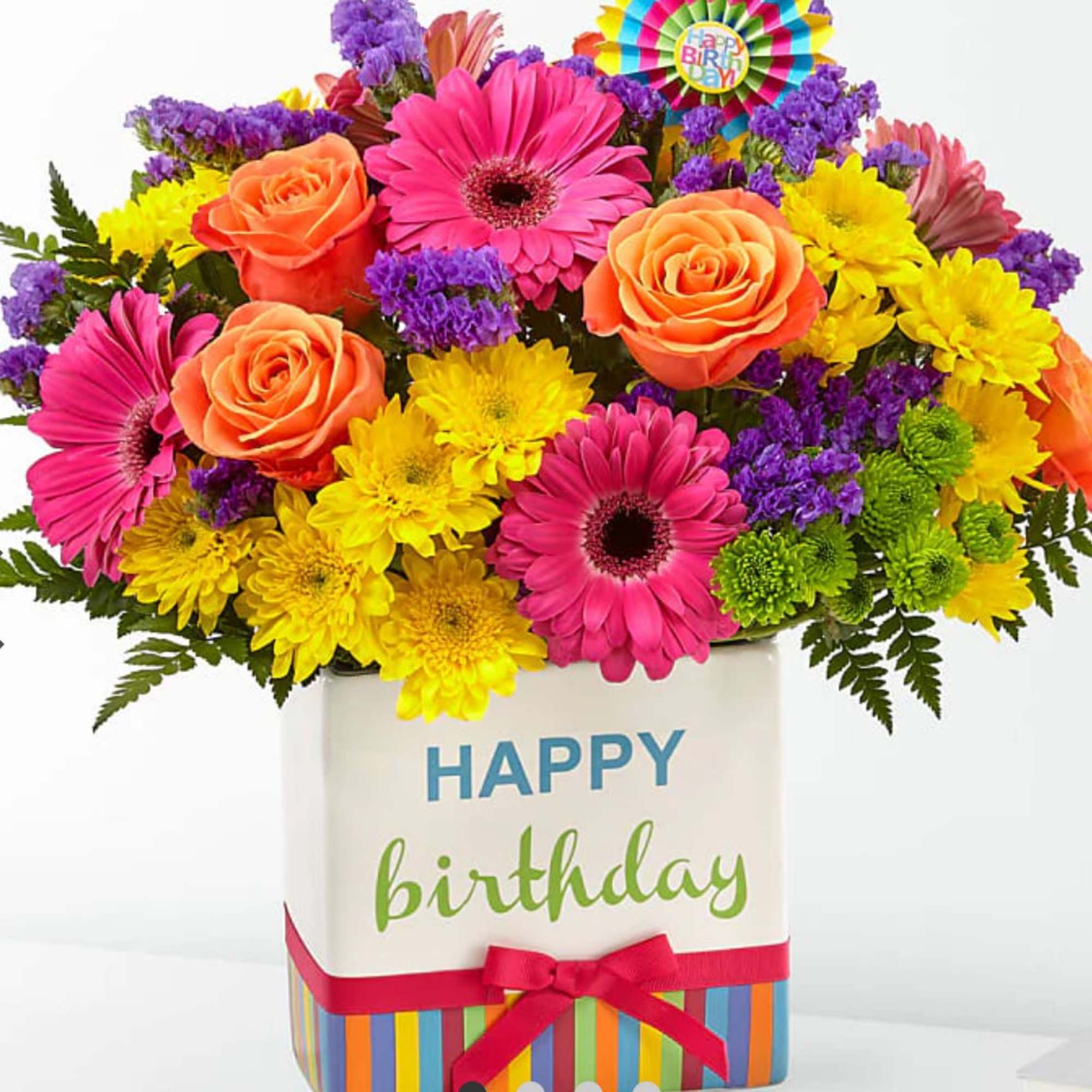 Bright mixed bouquet in a birthday gift box with a ribbon