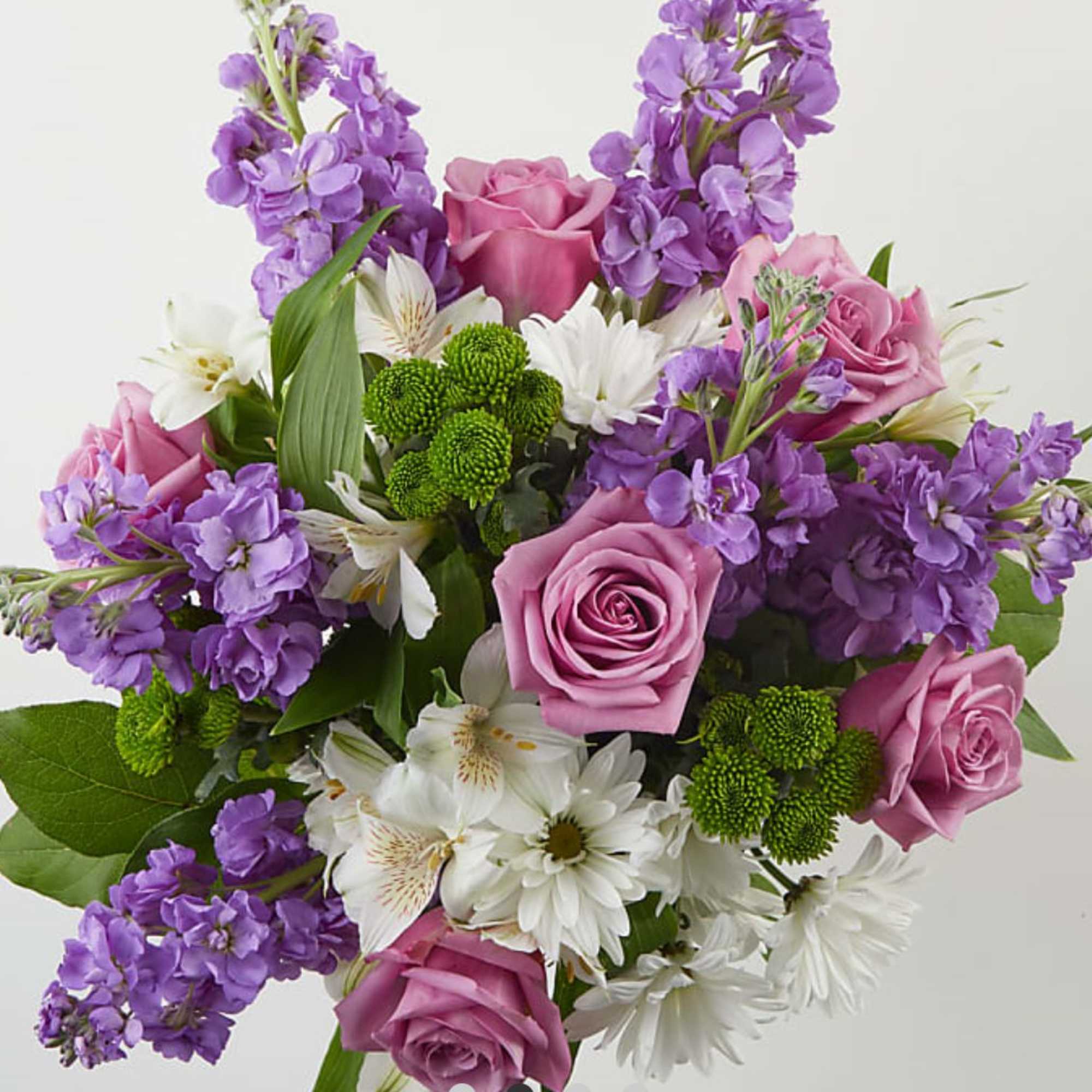 Bouquet of pink roses, purple stock, and white daisies