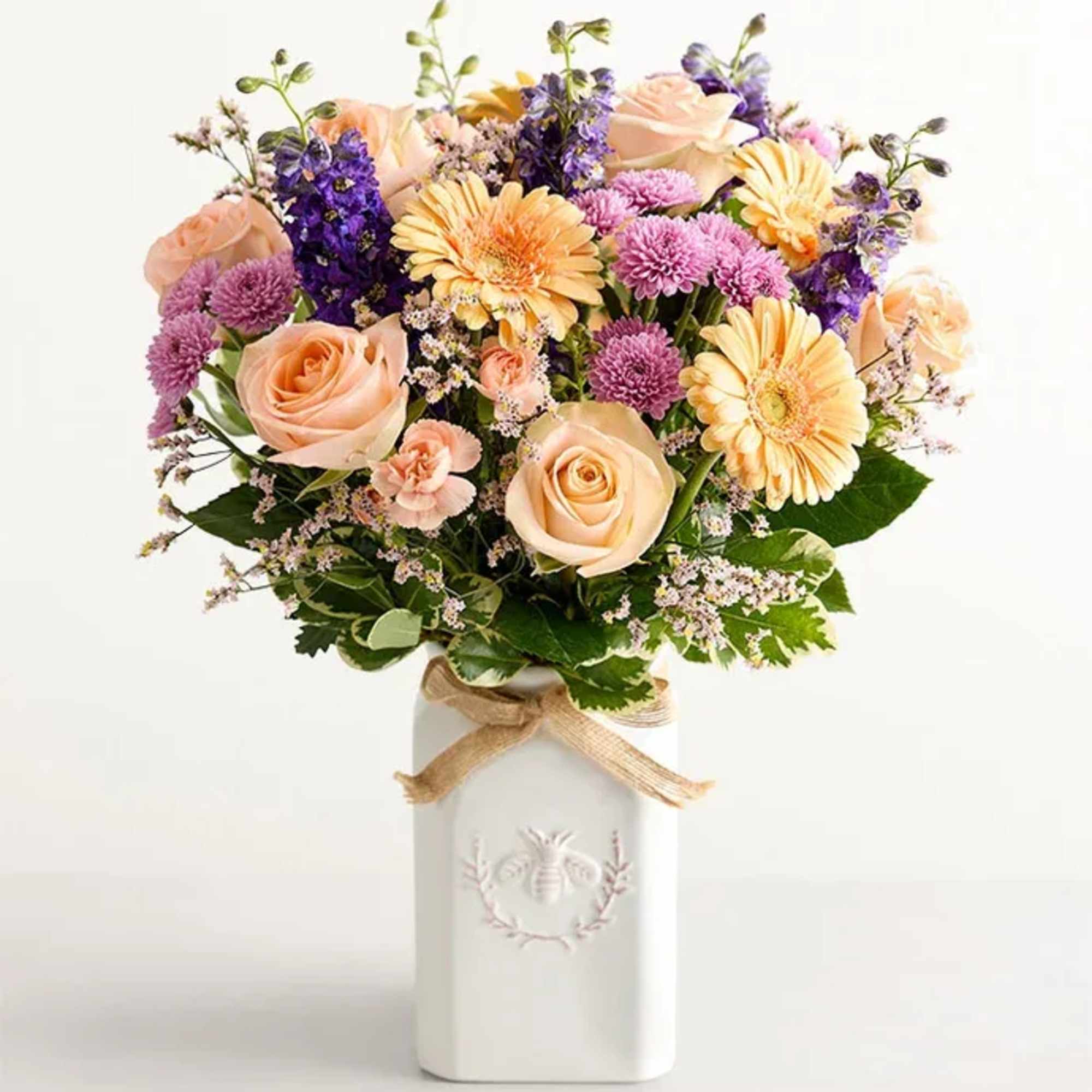 Get them buzzing with our charming bouquet! A garden-fresh gathering of blooms