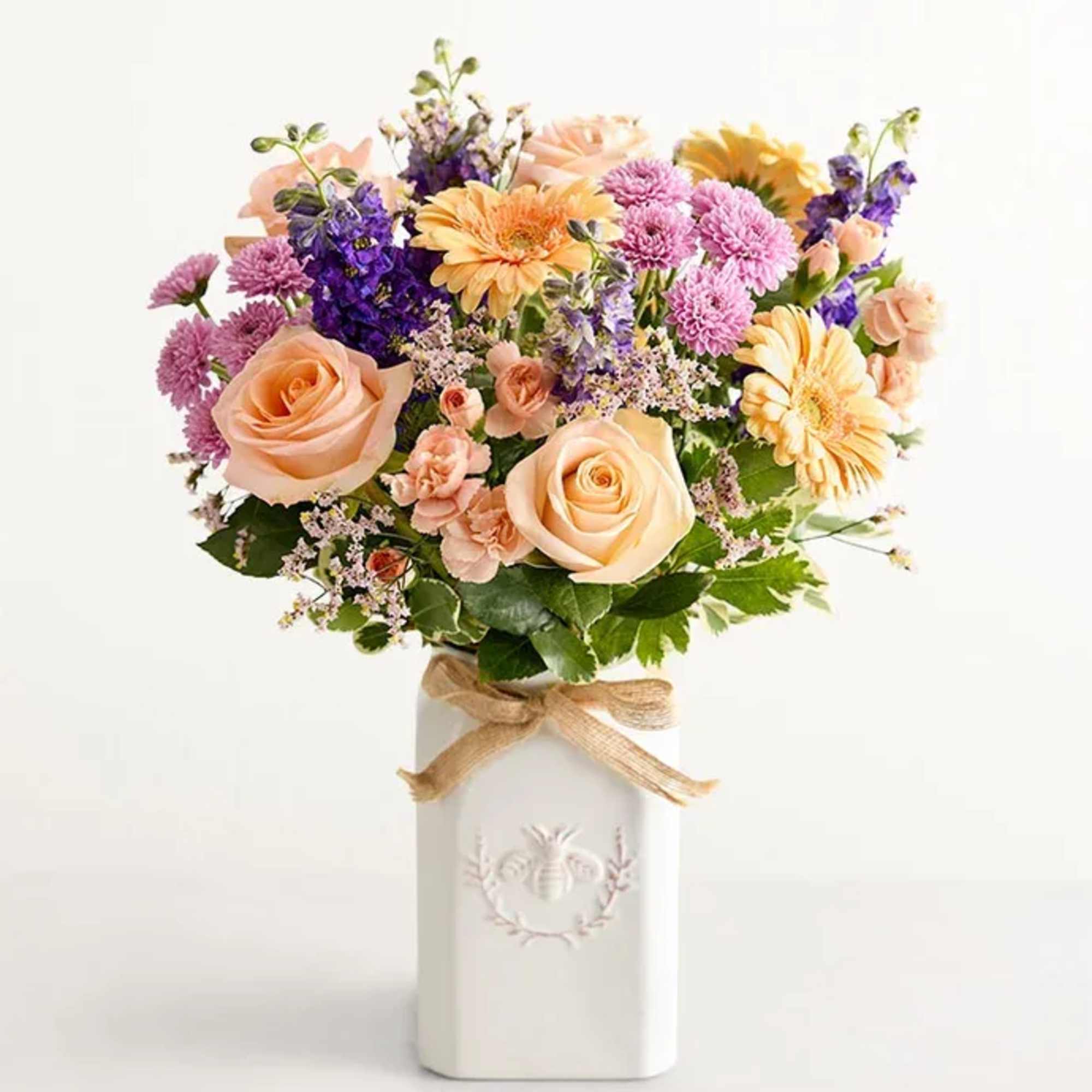 Get them buzzing with our charming bouquet! A garden-fresh gathering of blooms