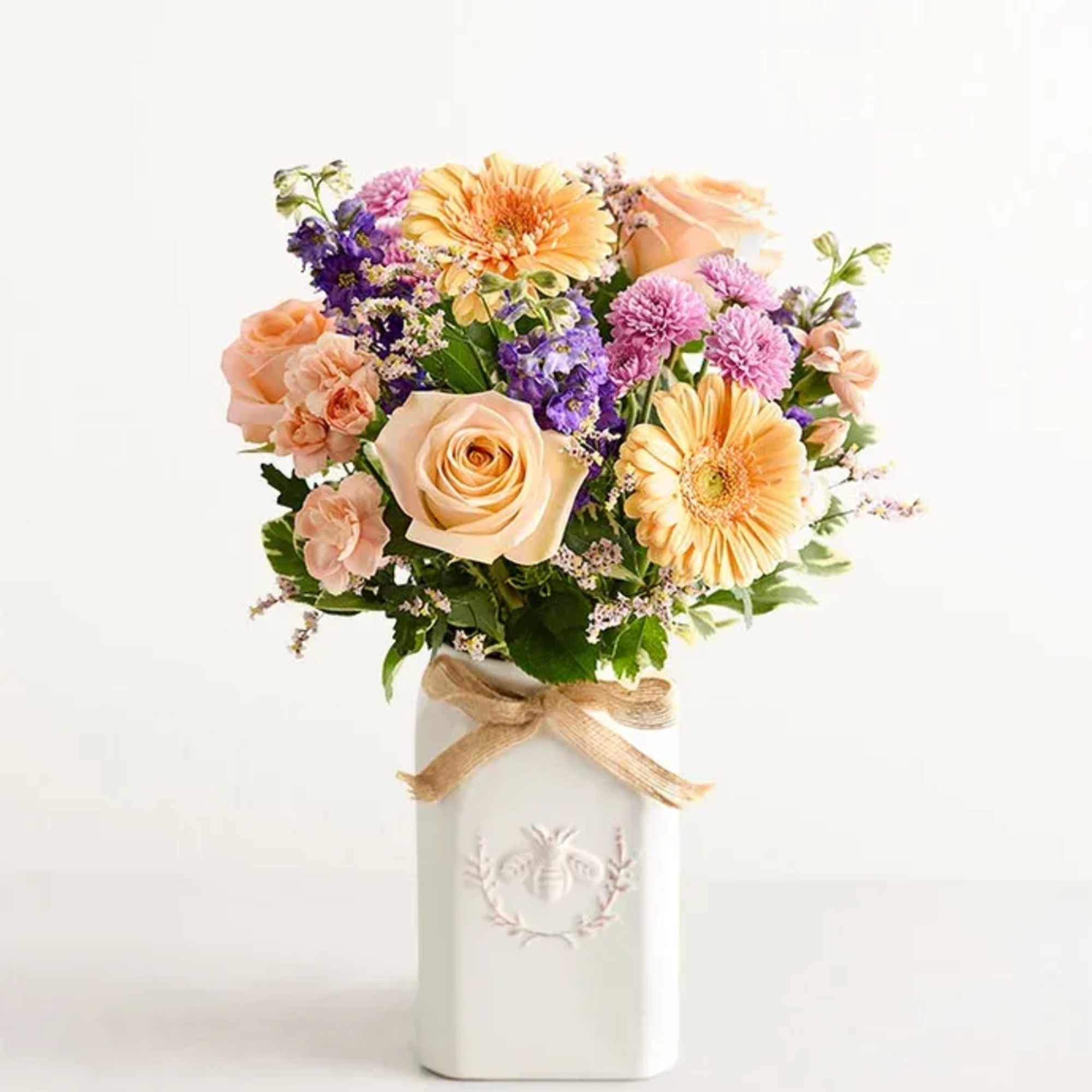 Get them buzzing with our charming bouquet! A garden-fresh gathering of blooms