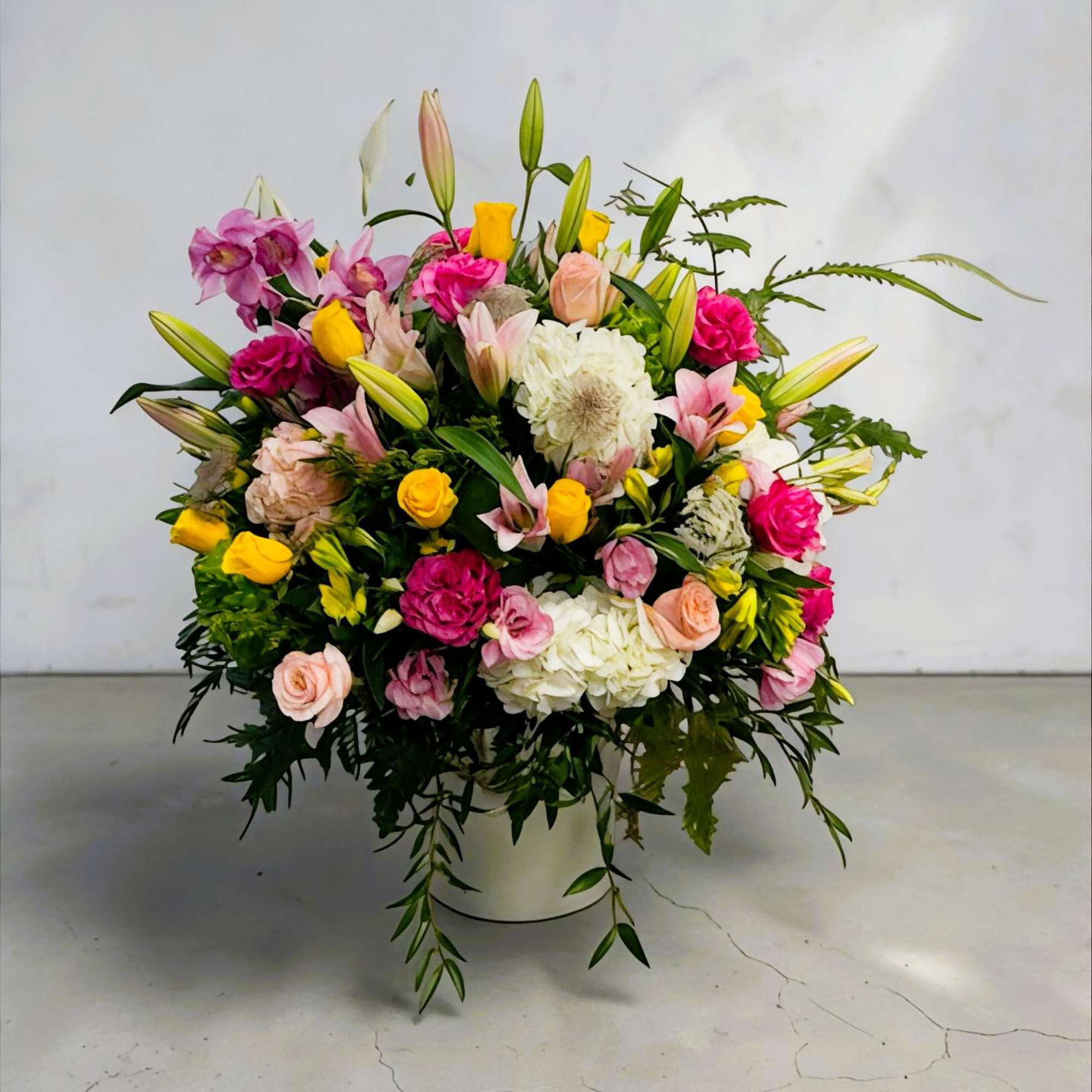 A bright, cheerful mixed flower arrangement that makes anyone feel celebrated-perfect as