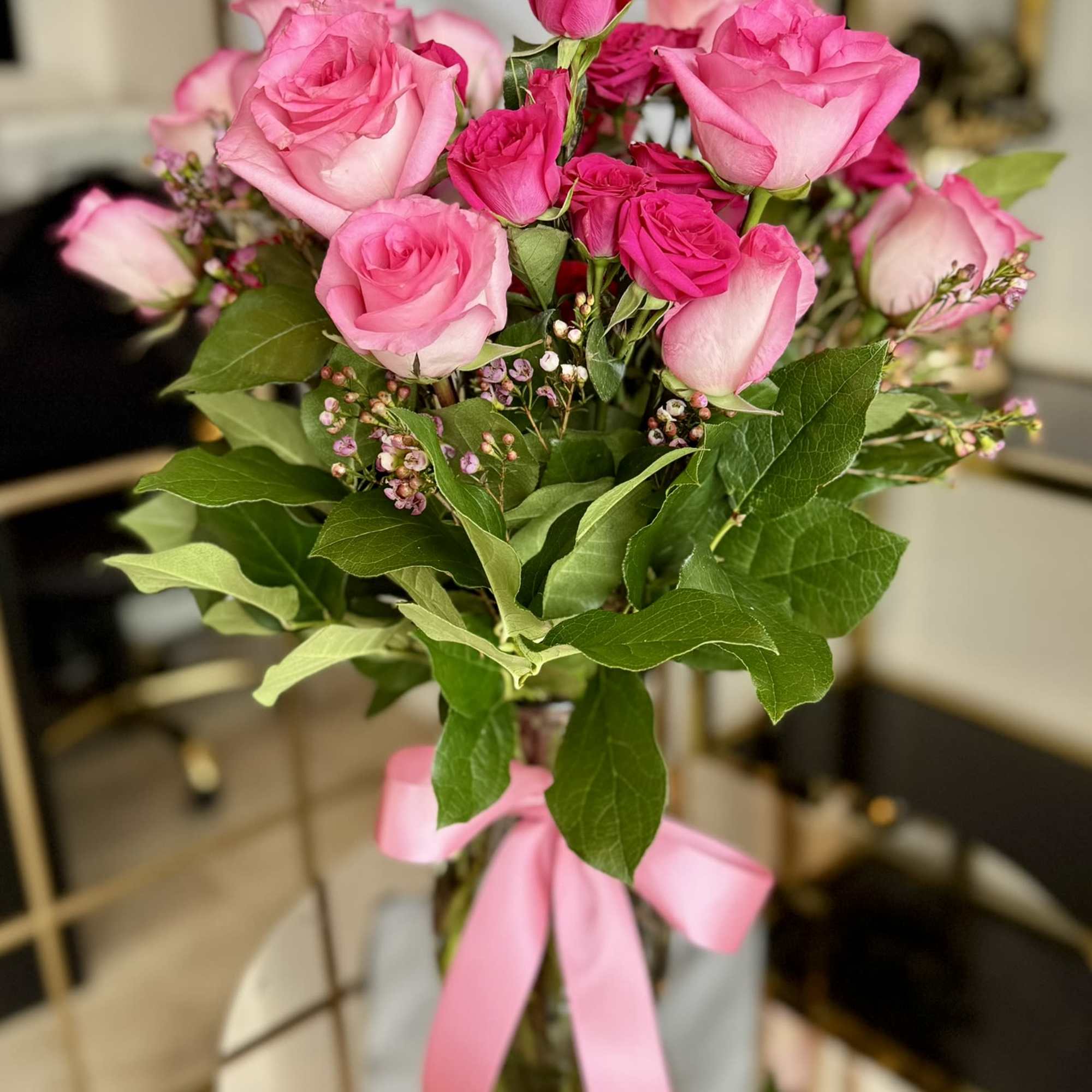 Bouquet of pink roses tied with a pink ribbon