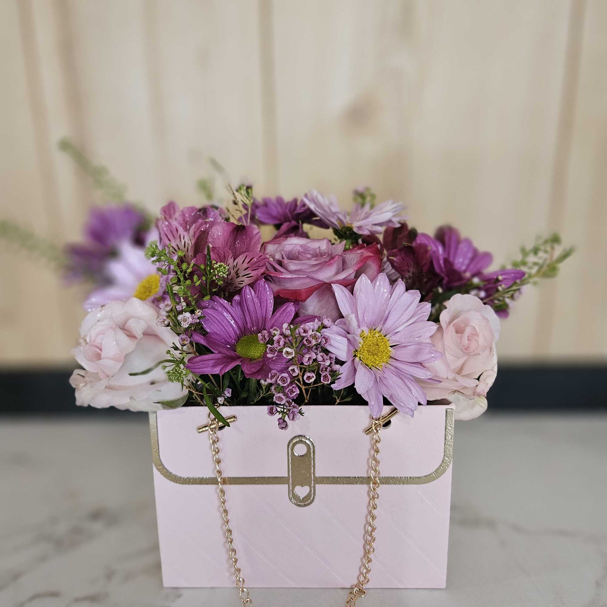Soft, delicate, and effortlessly charming.  Arranged in a mini floral hand