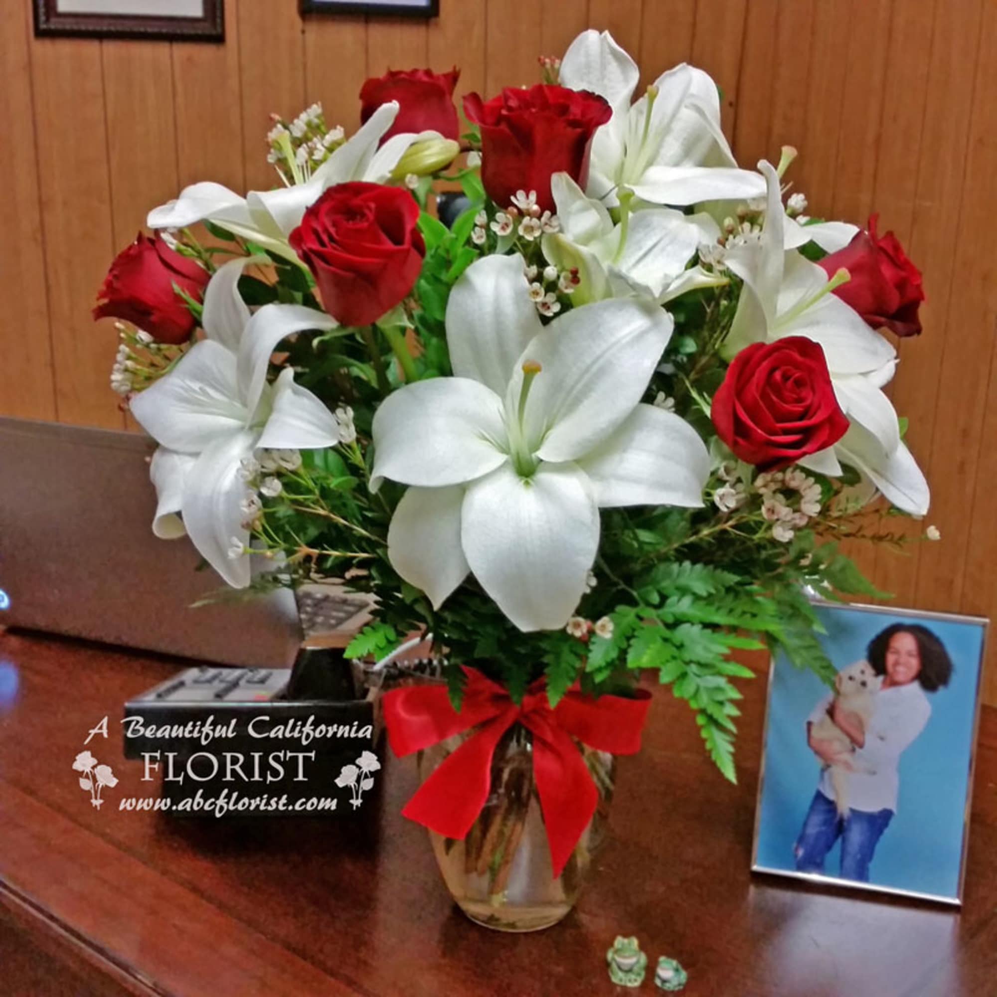 Beautiful red roses paired with white lilies make for a stunning combination.