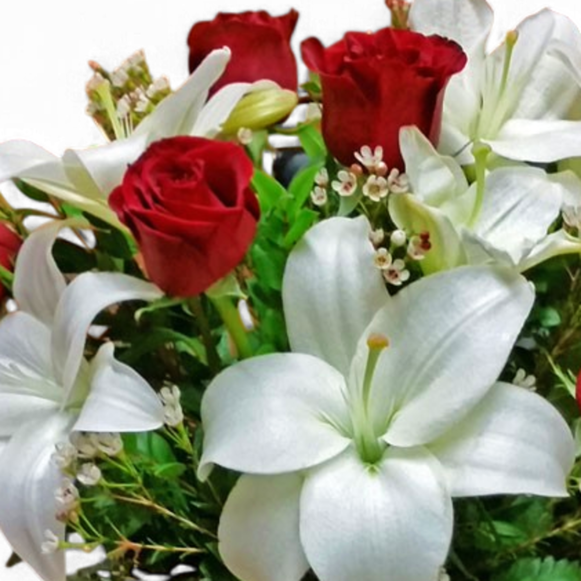 Red roses and white lilies in a mixed bouquet