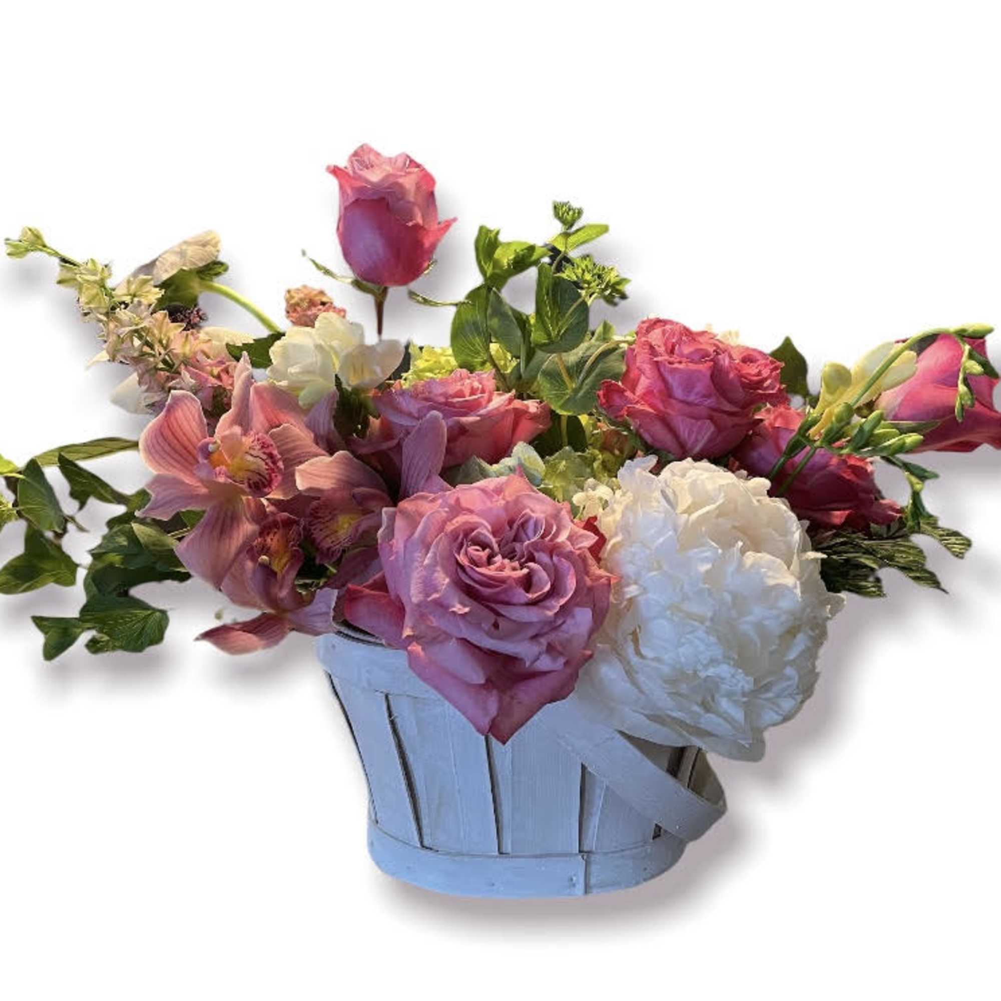 Pink roses and white blooms in a light blue basket
