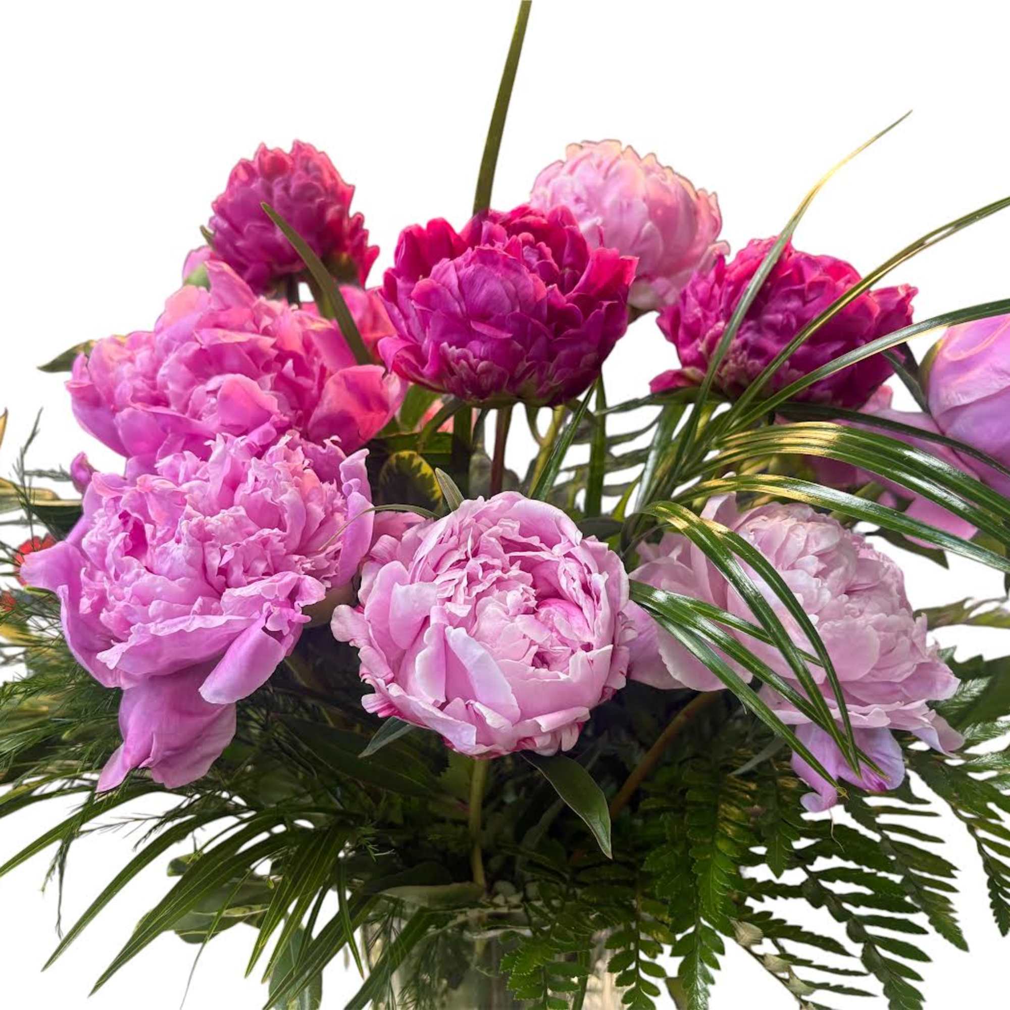 A cloud of lush pink peonies takes center stage in this flower