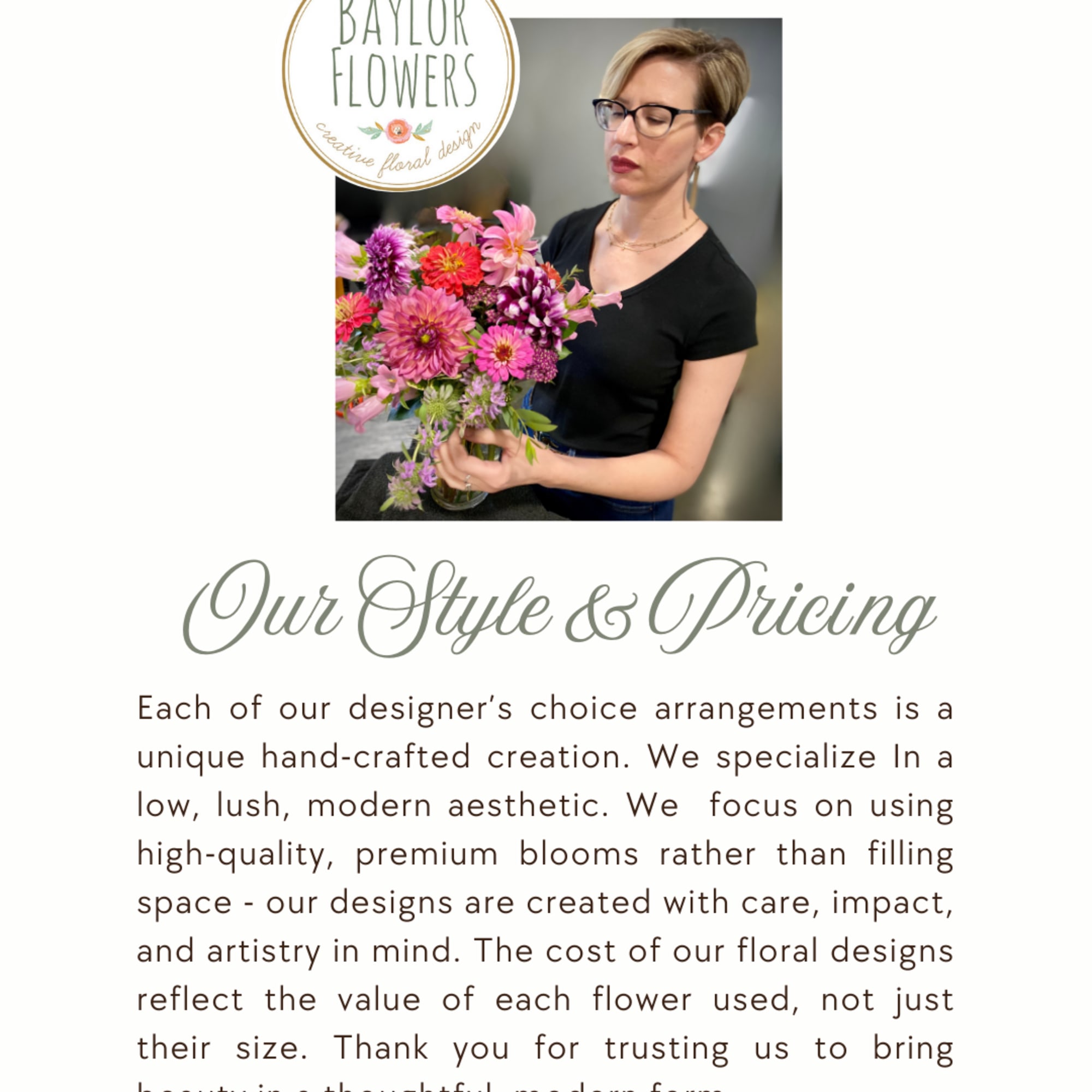 Designer holds a colorful mixed bouquet with pink and purple blooms in a vase.